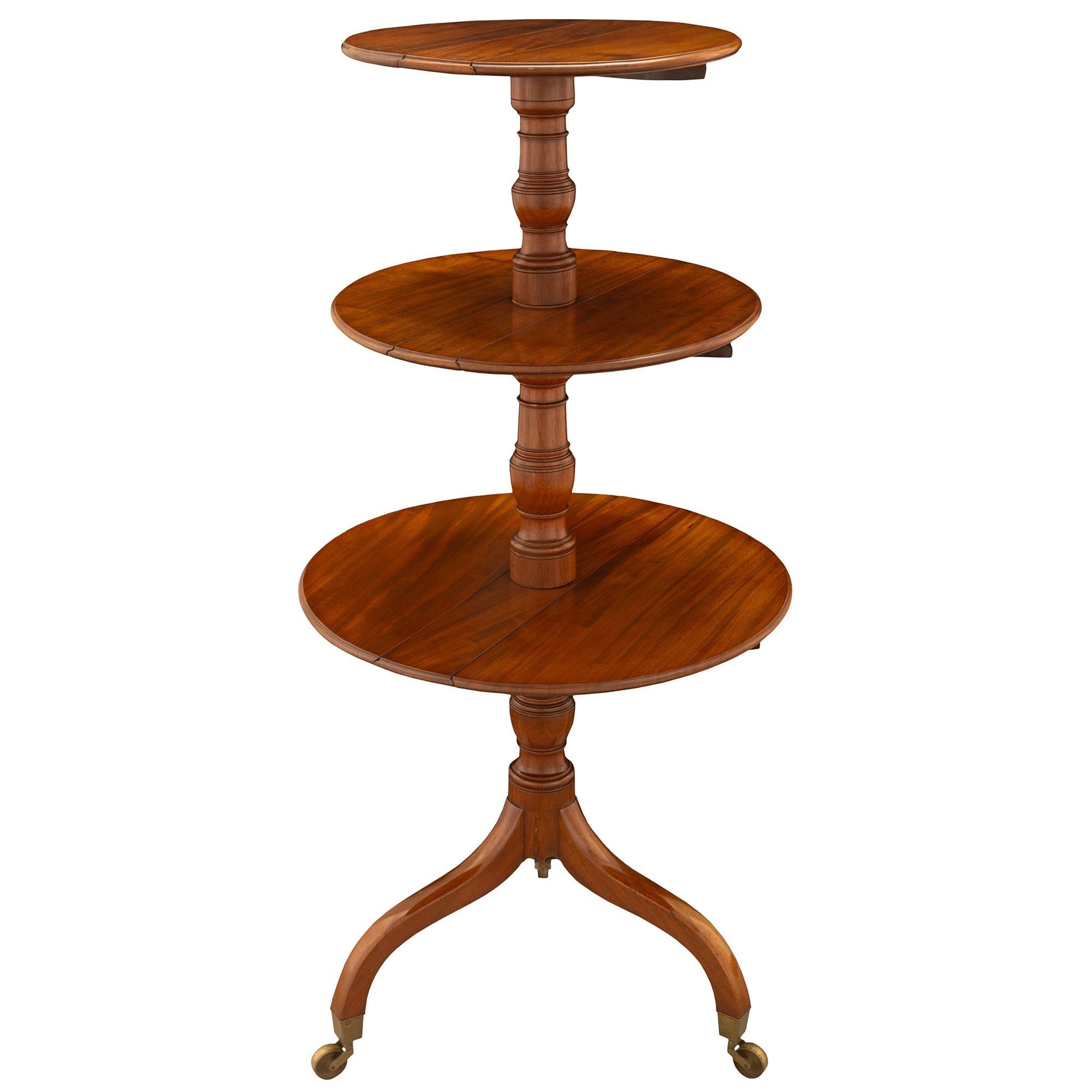 An elegant early 19th century English Regency st. mahogany three-tier serving table. The table often referred to as a 