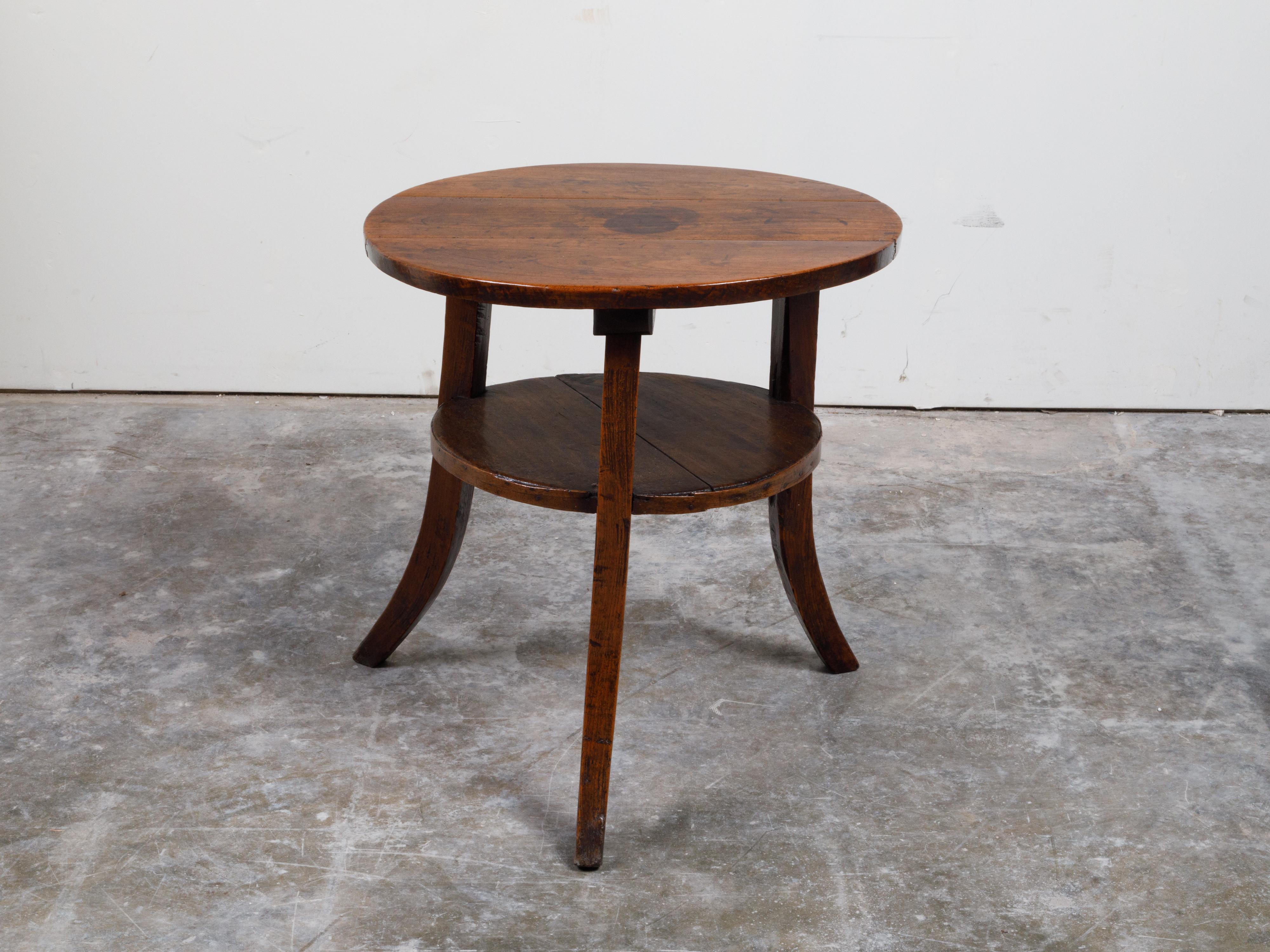 English 19th Century Round Top Walnut Side Table with Shelf and Saber Legs 6