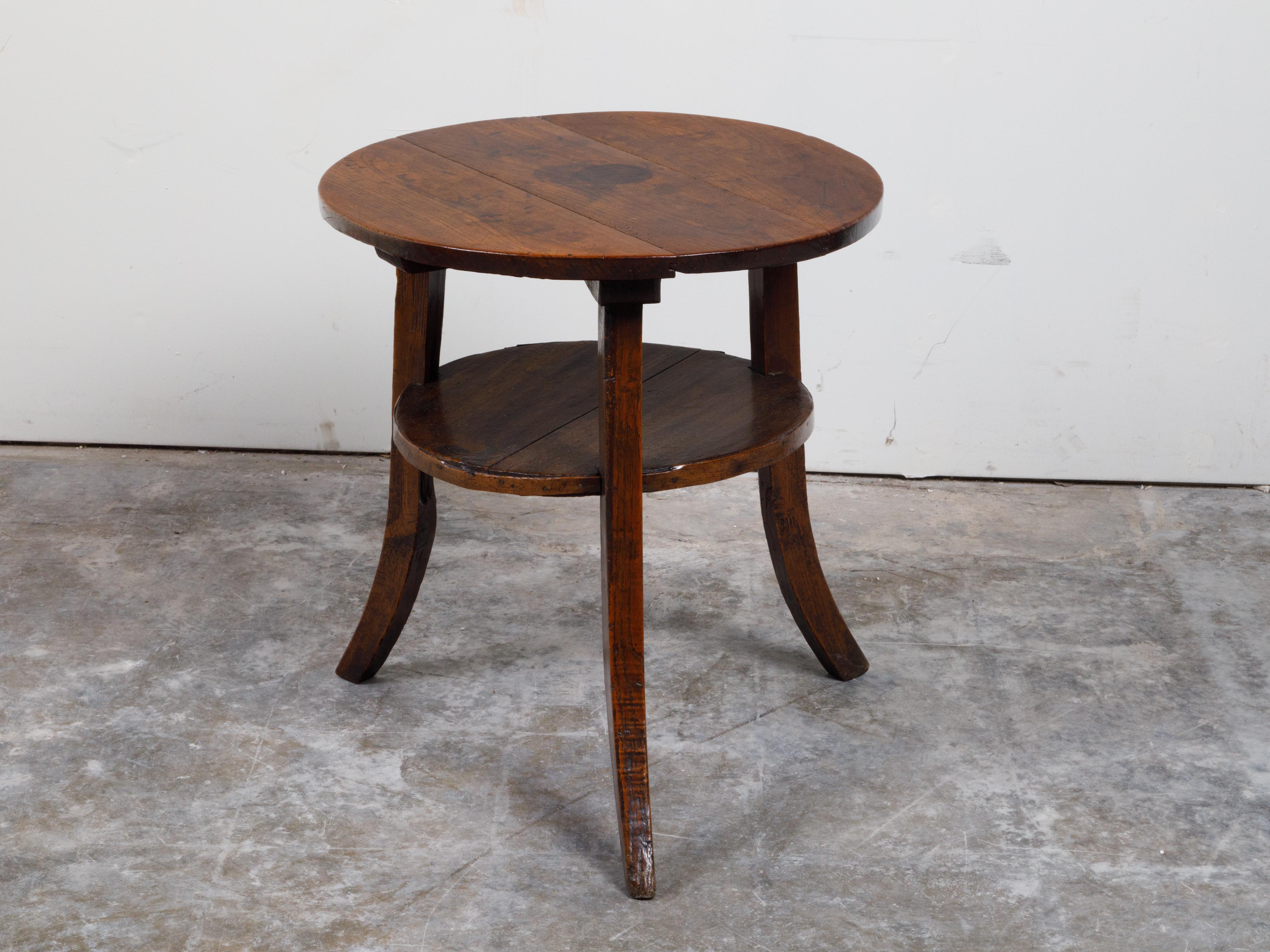English 19th Century Round Top Walnut Side Table with Shelf and Saber Legs 4
