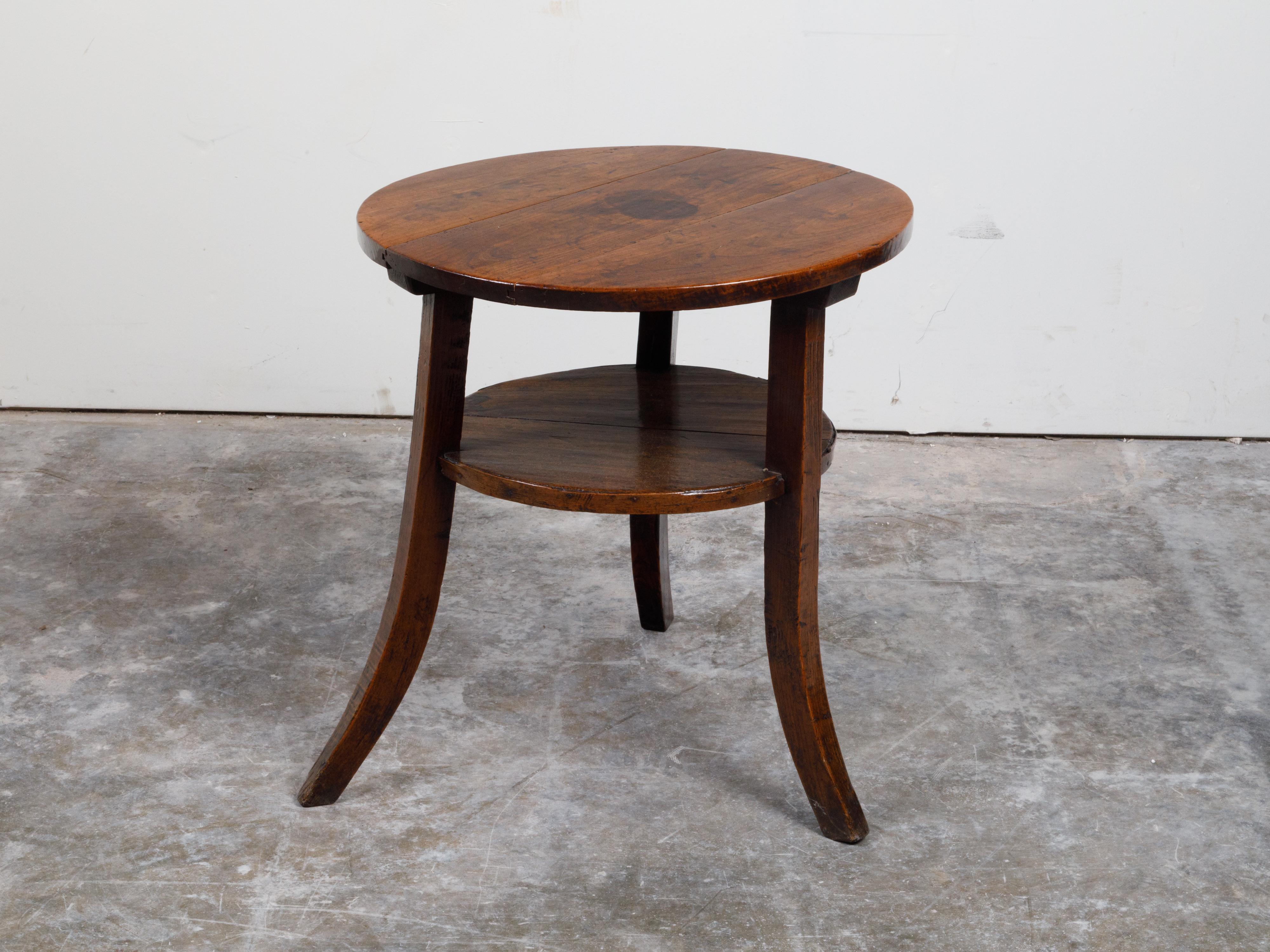 English 19th Century Round Top Walnut Side Table with Shelf and Saber Legs 5