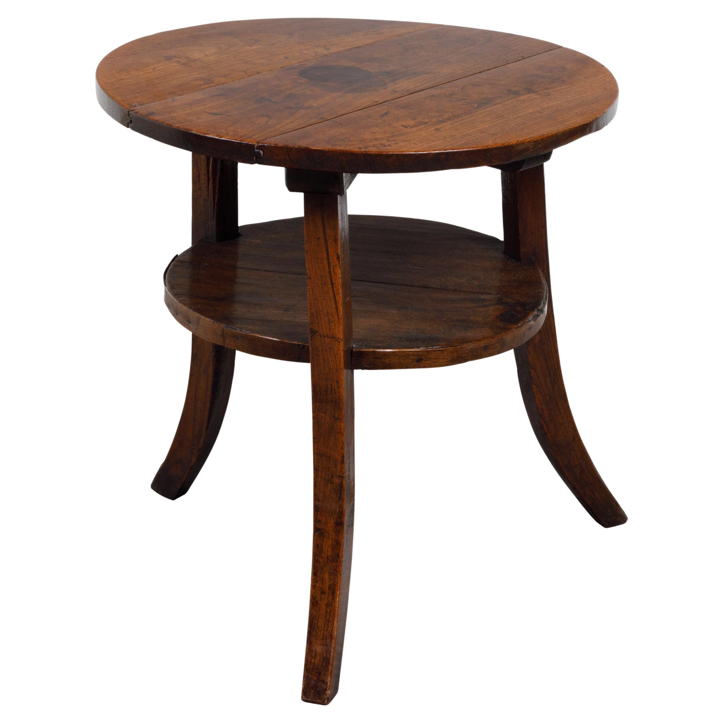 English 19th Century Round Top Walnut Side Table with Shelf and Saber Legs