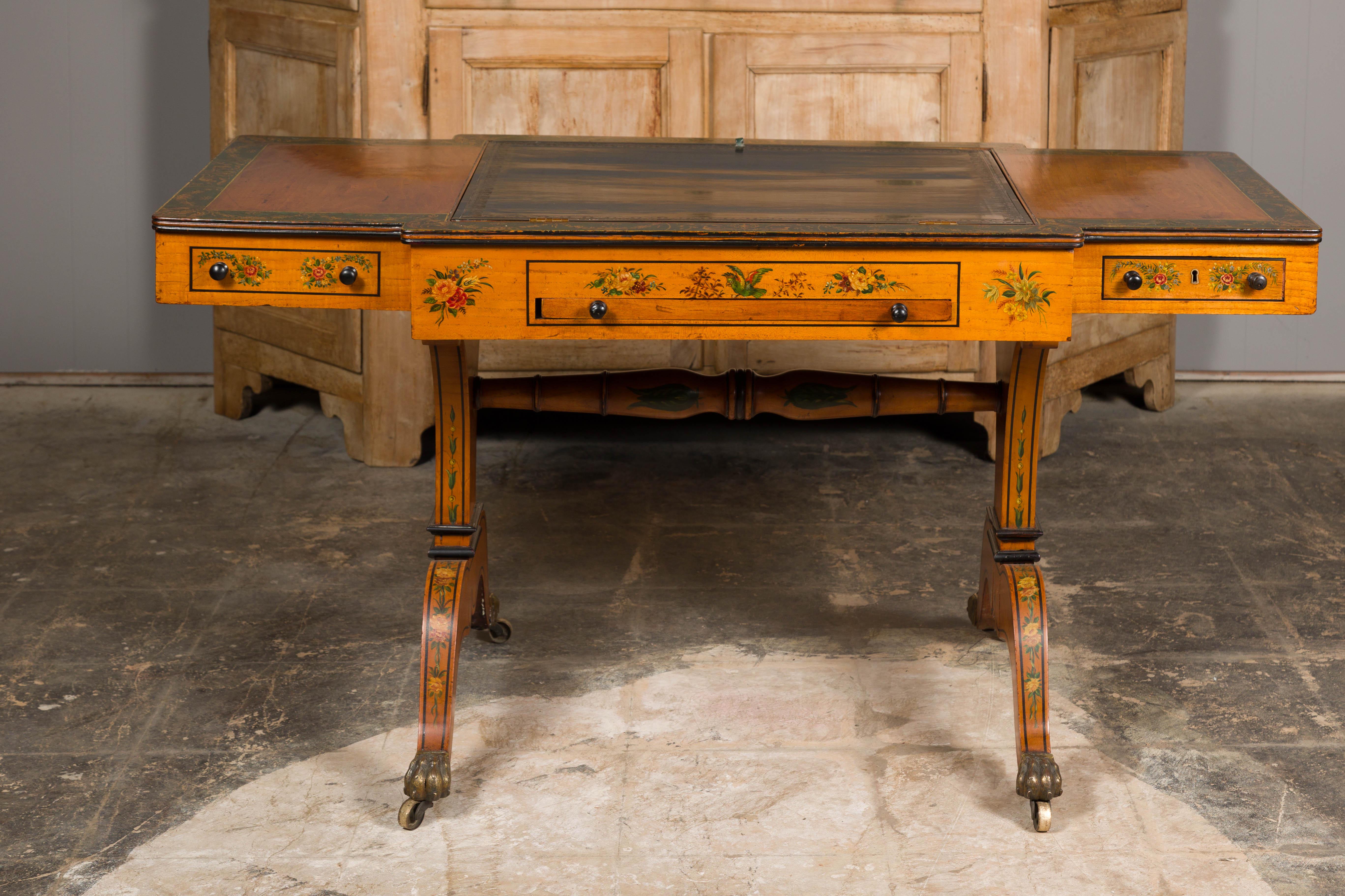 An English satinwood desk and game table from the 19th century with tilt top writing area, checkerboard and two drawers. This 19th-century English satinwood desk and game table is a masterpiece of both functionality and artistic craftsmanship. Its