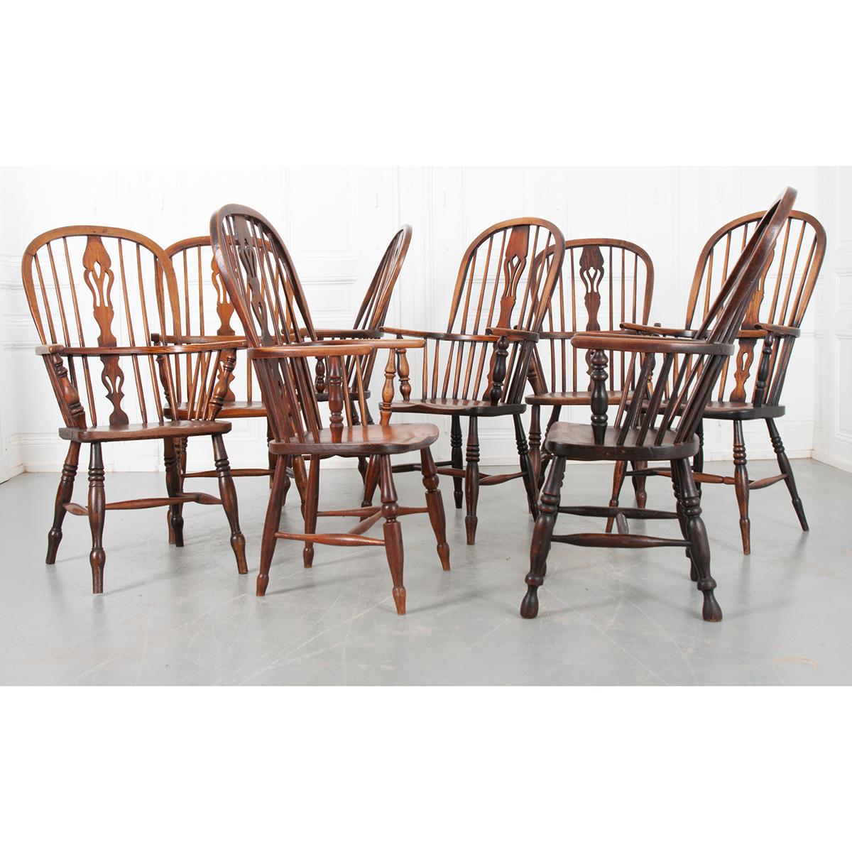 A wonderful set of eight English solid oak Windsor chairs have been cleaned, tightened, and polished. They are very sturdy resting on four turned legs with ‘H’ stretchers and comfortable. Each one is slightly different making a fine set. They would