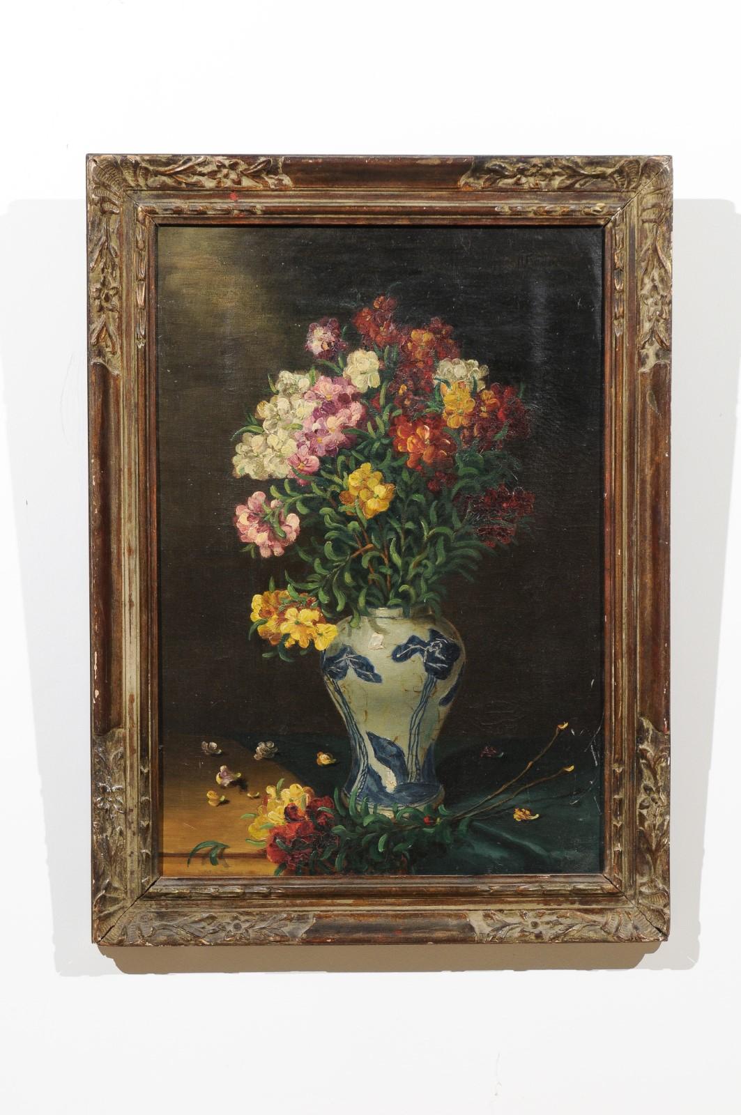 An English framed still-life painting from the 19th century depicting a bouquet of flowers in blue and white porcelain and signed Henry Roberts. Born in England during the 19th century, this elegant still-life painting depicts a colorful bouquet of