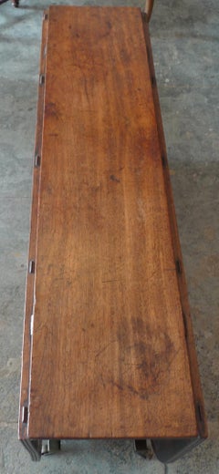 English 19th Century Stained Elm and Mahogany Drop-Leaf Table on 4 Iron Castors