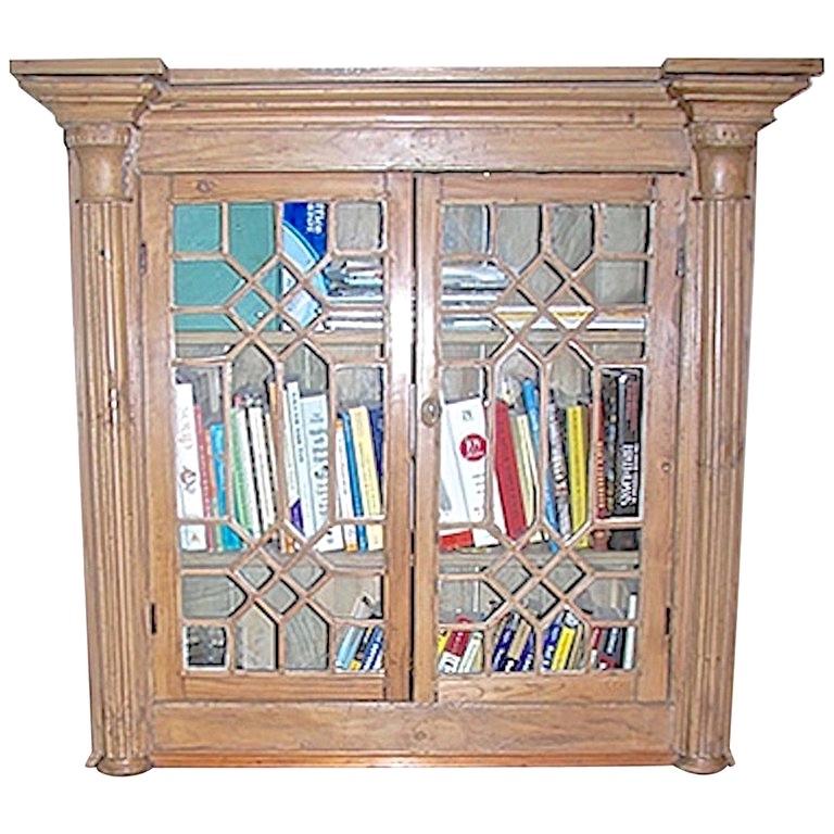English 19th century stained two part pine library bookcase with two long doors with original glass, two solid doors and three shelves.
Cost of top piece $1,747
Cost of bottom piece $1,747.