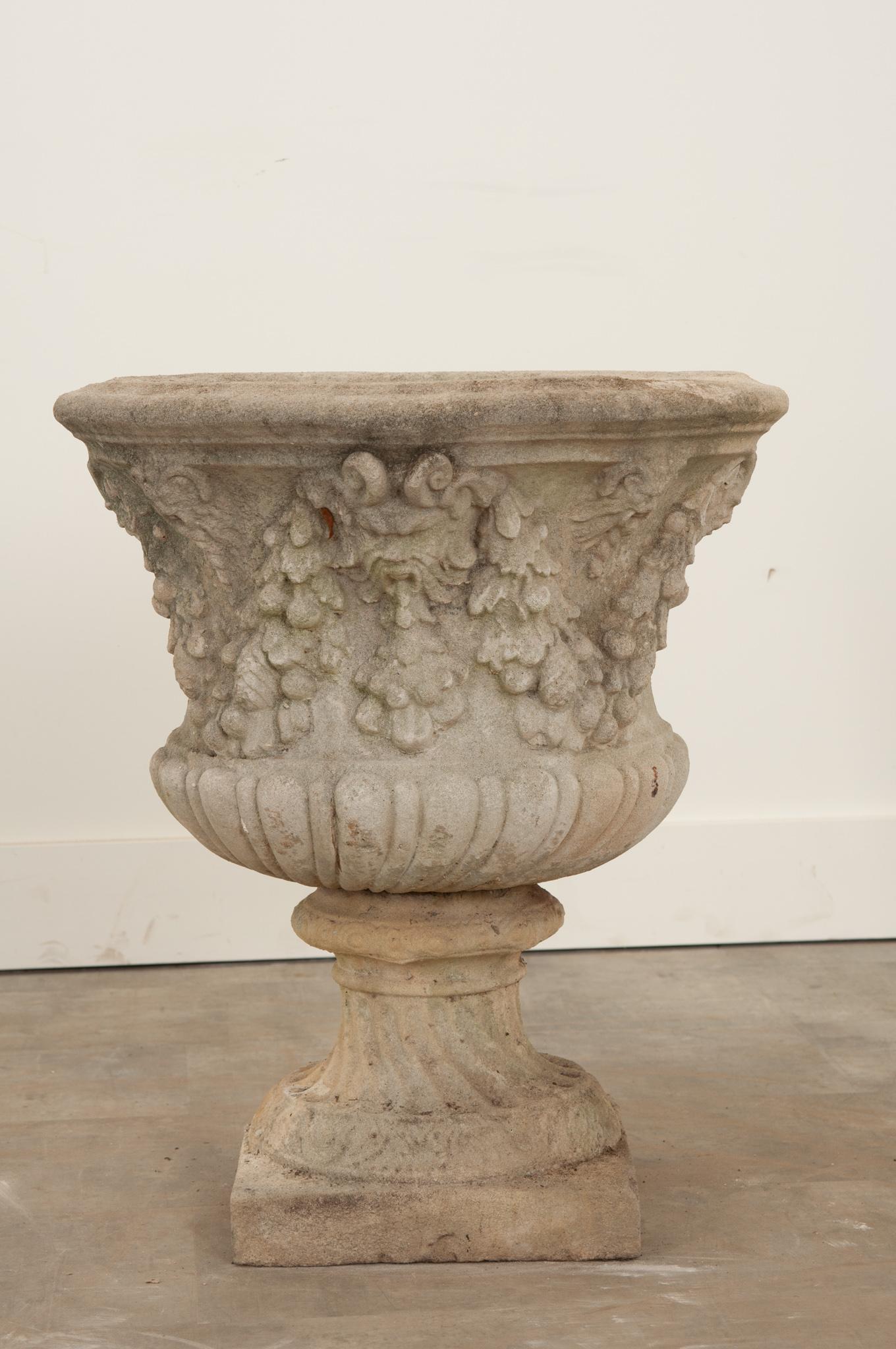 A delightful stone planter with an abundance of folate motifs and gargoyle faces. Water drainage hole is present. Basin is removable from the pedestal. Square base measures 12”x12”. Years of exposure to the elements have given it a great patina.