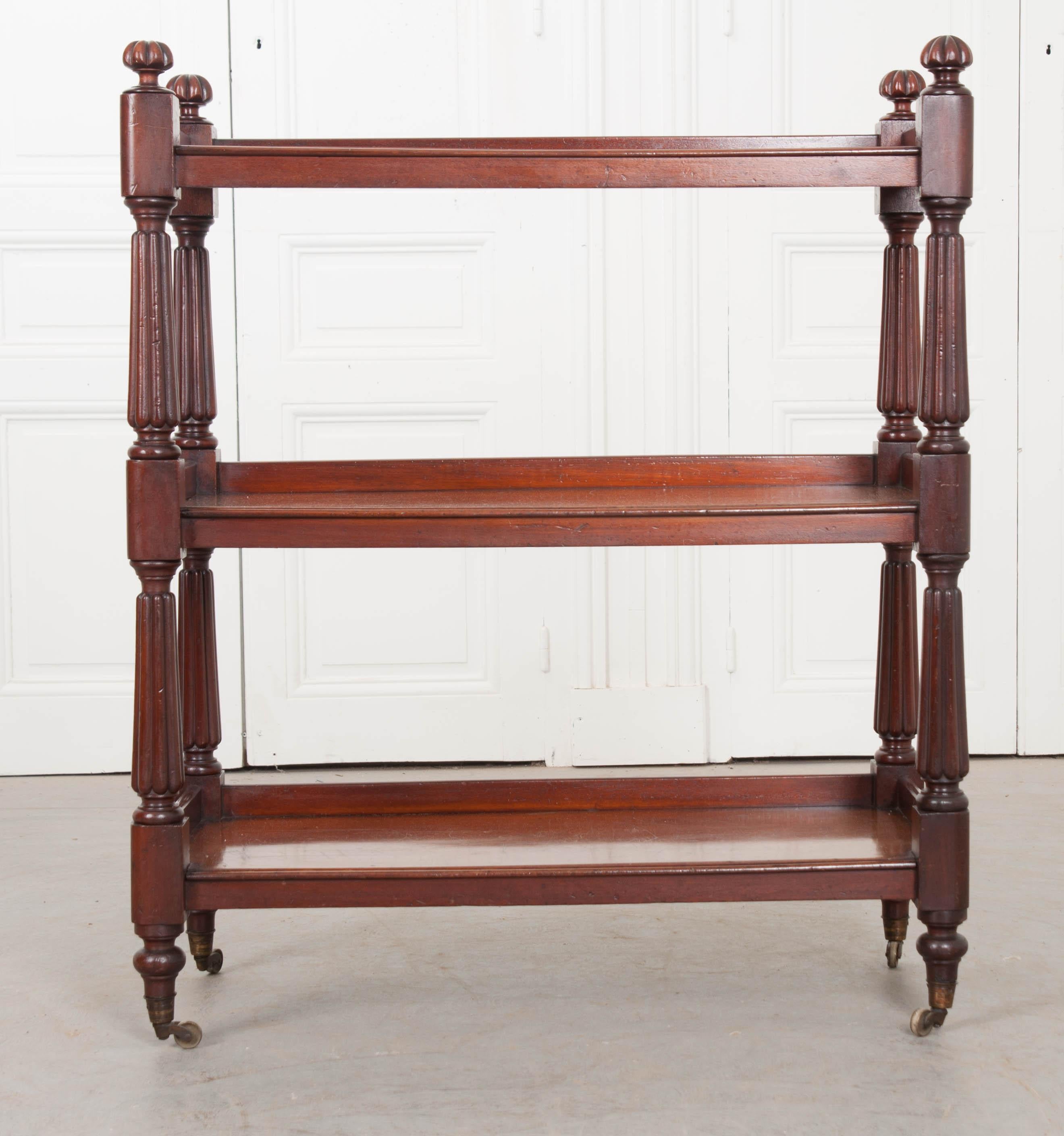 A gorgeous, beautifully carved mahogany tea trolley for serving food, drinks or displaying your collectibles. We love this antique’s versatility! This trolley retains its beautiful, rich, original color and patina and has a fresh French polish,