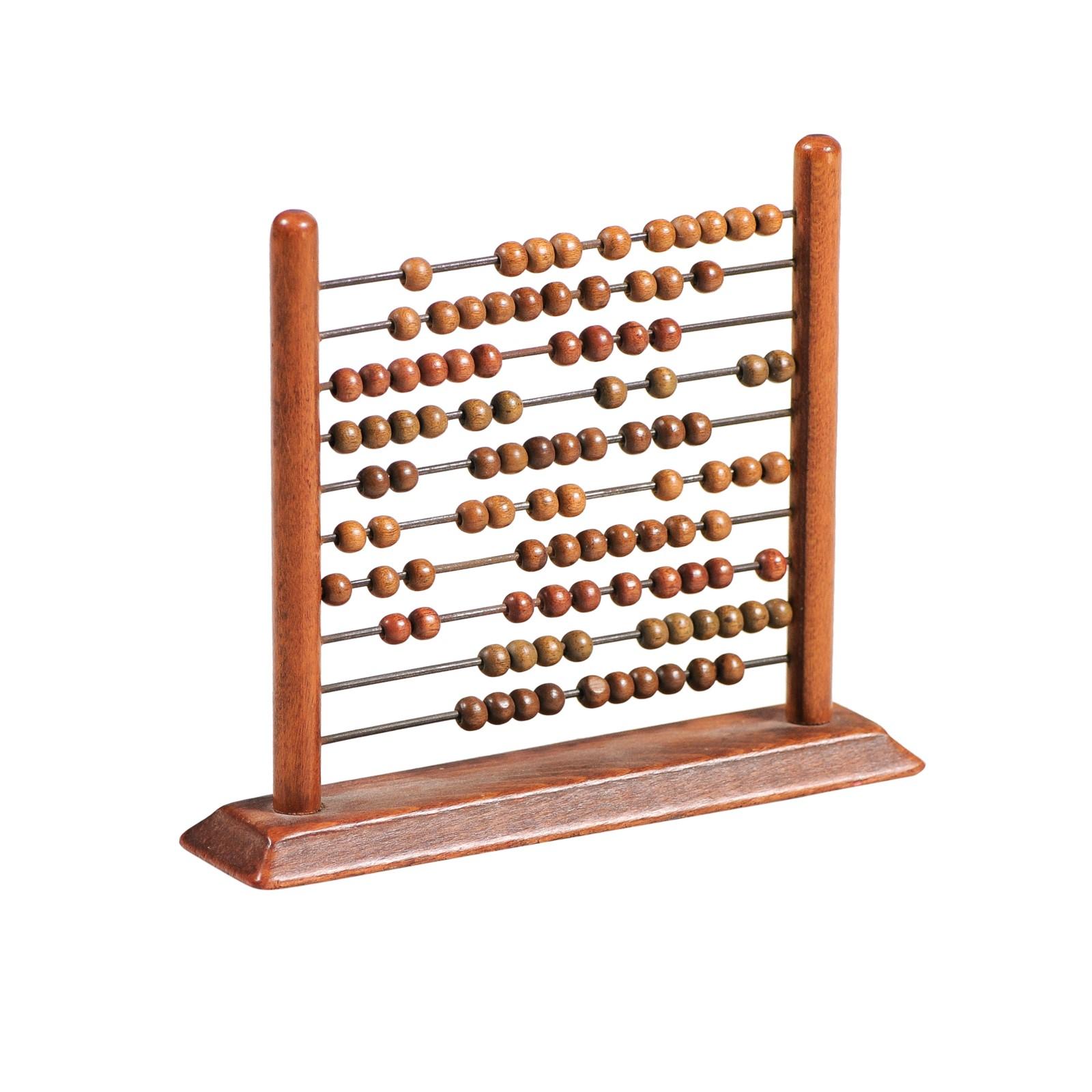 An English Victorian period abacus from the 19th century, with wooden frame, iron rods and wooden beads. Created in England during Queen Victoria's reign, this wooden abacus is an example of one of the most well-known and least understood tools for
