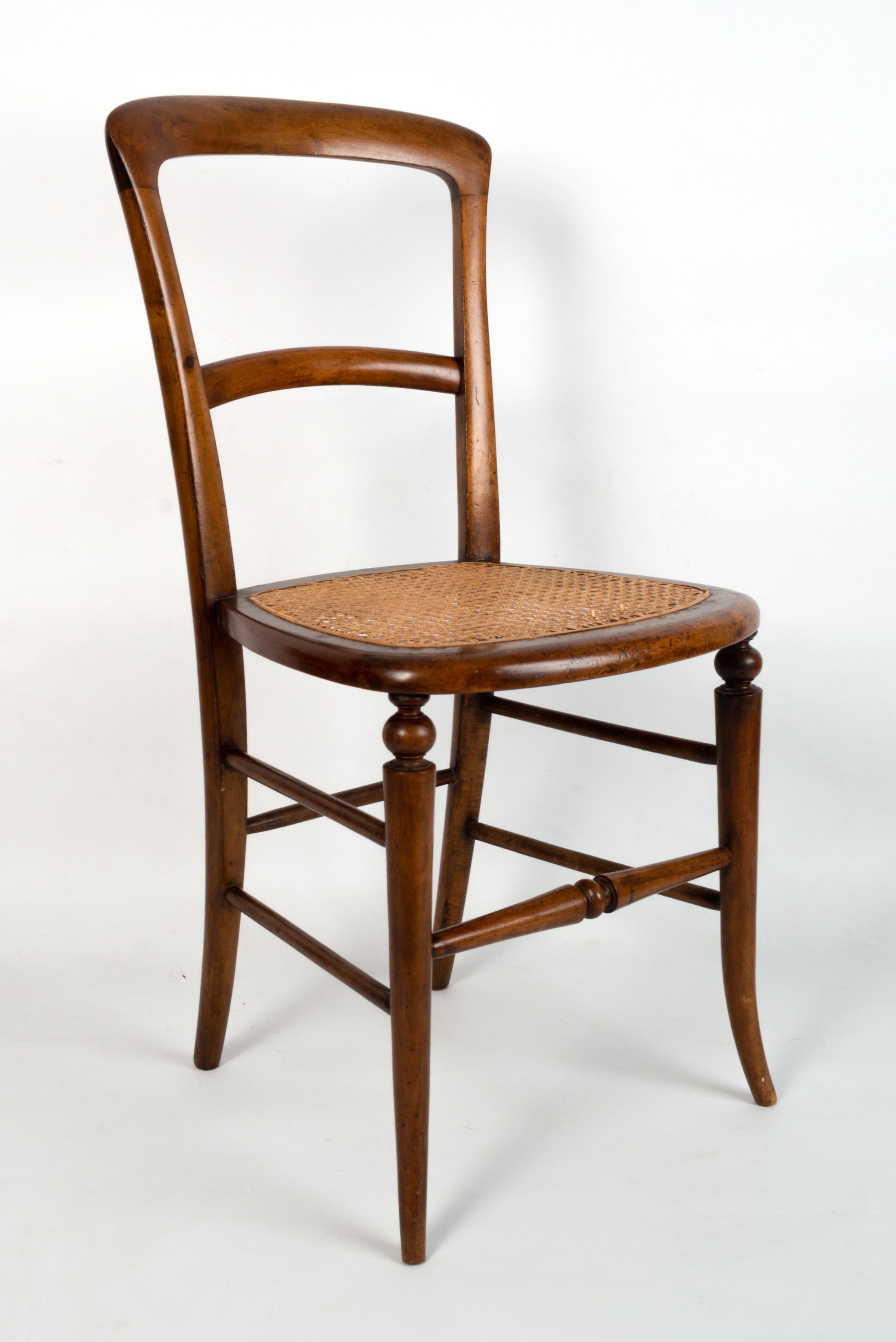 An English 19th Century Victorian Caned Walnut Salon Chair C.1860.

Very good condition commensurate with age. Solid and sturdy.