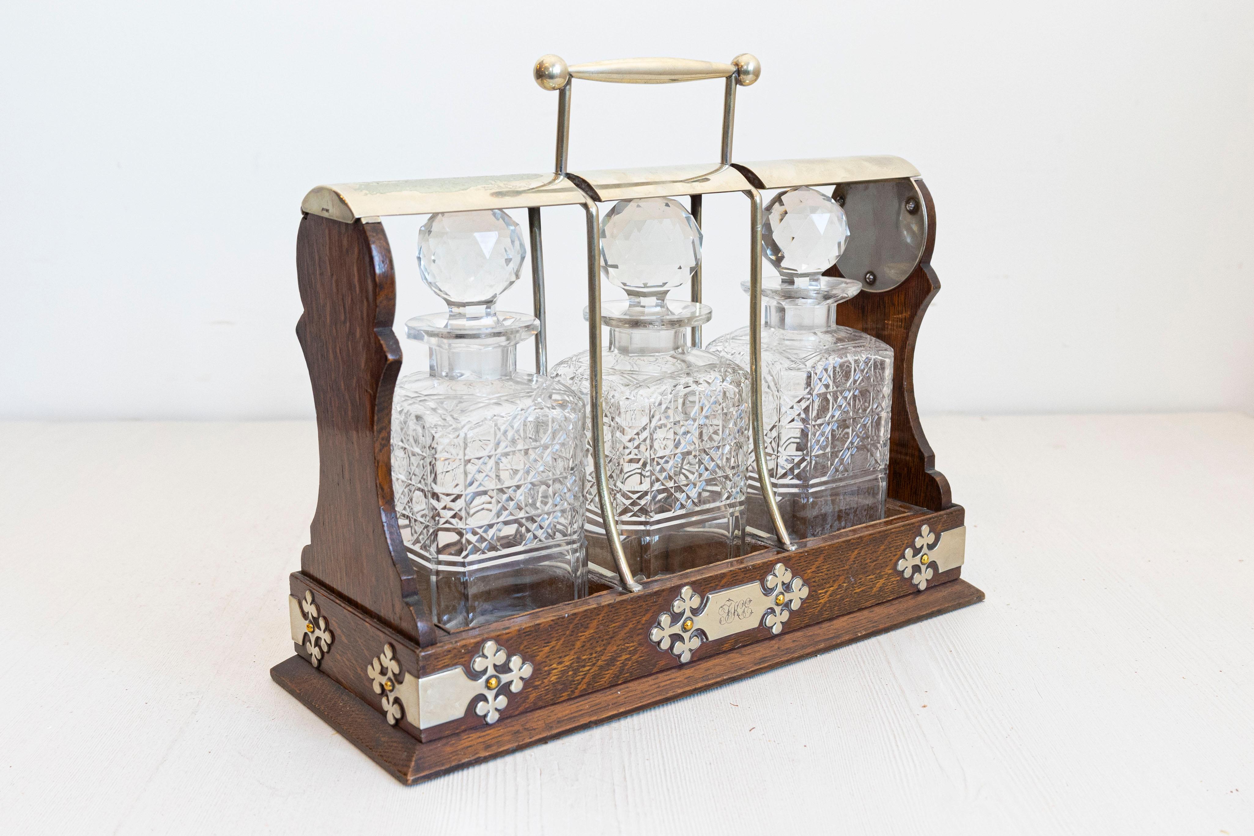 Silvered English 19th Century Victorian Locking Tantalus with Three Cut Glass Decanters For Sale