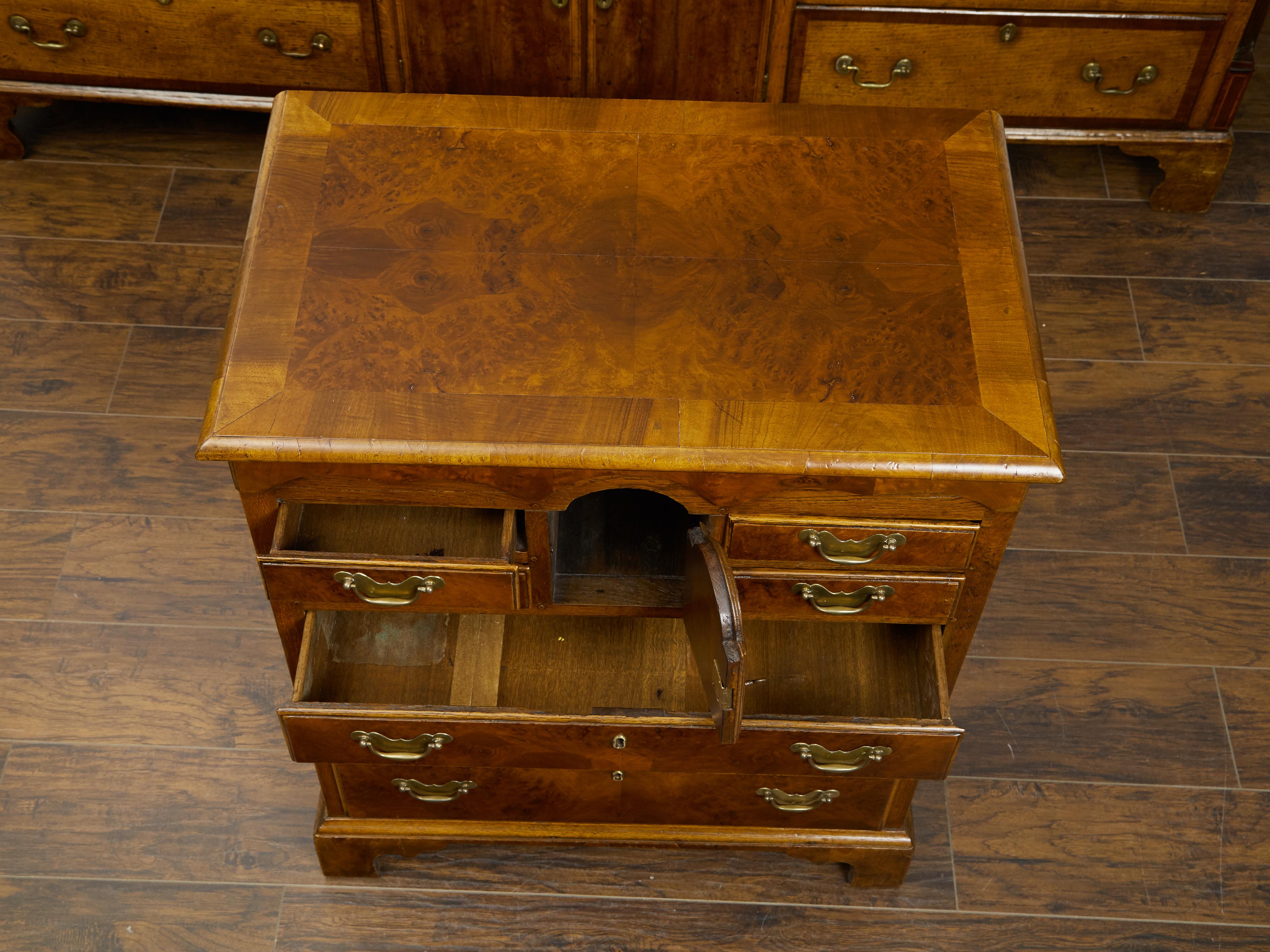 Brass English 19th Century Walnut Commode with Graduating Drawers and Petite Door For Sale