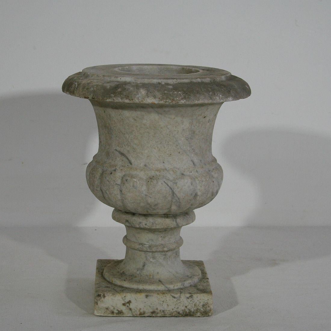 Rare white marble garden urn, England, circa 1800-1850. Weathered, some small losses.










  