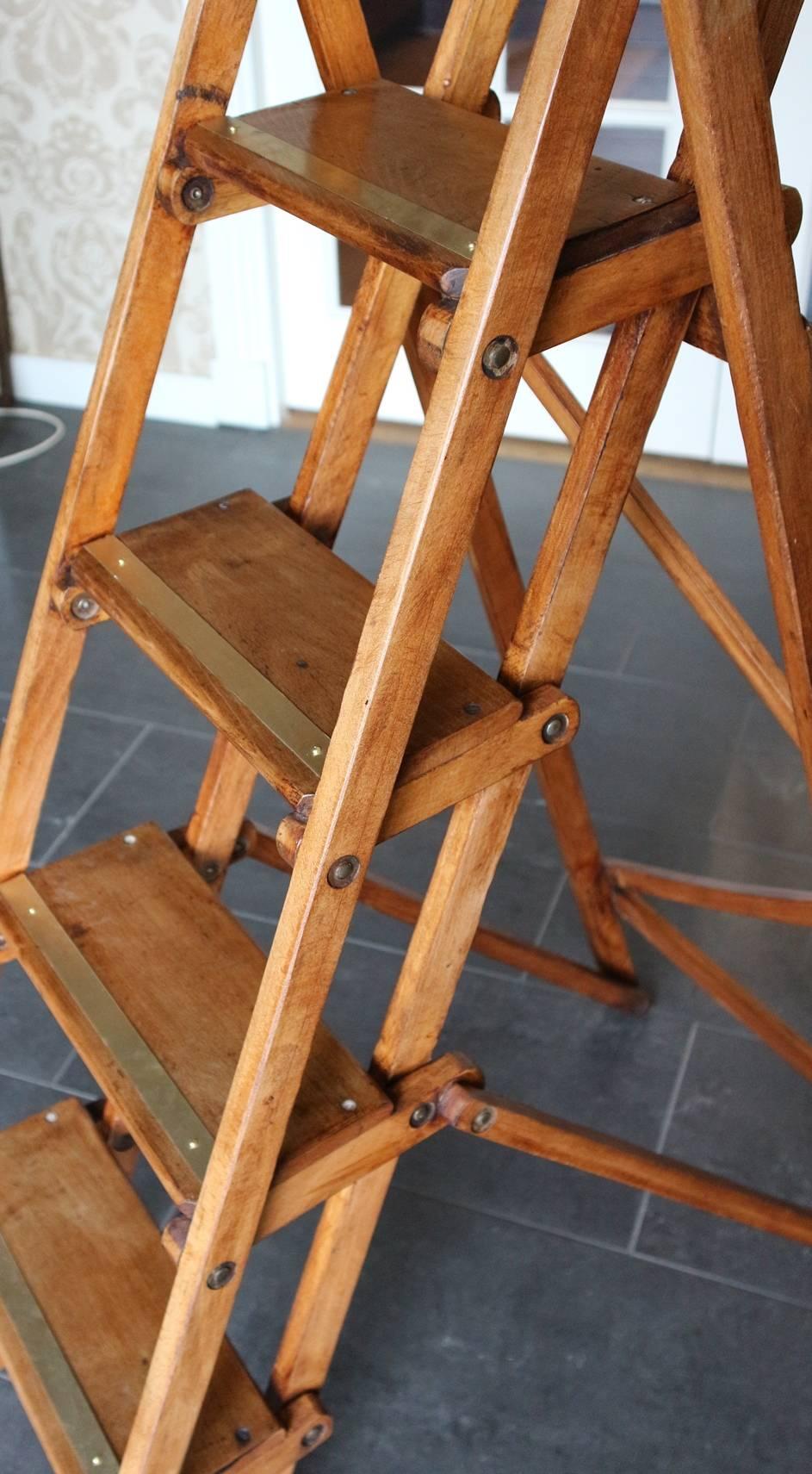 Beautiful and solid wooden step ladder. In perfect state. Beechwood. Brass strips are newly applied for more grip.
Origin: England
Period: circa 1900-1920
Size: Height 124cm, W 39cm.