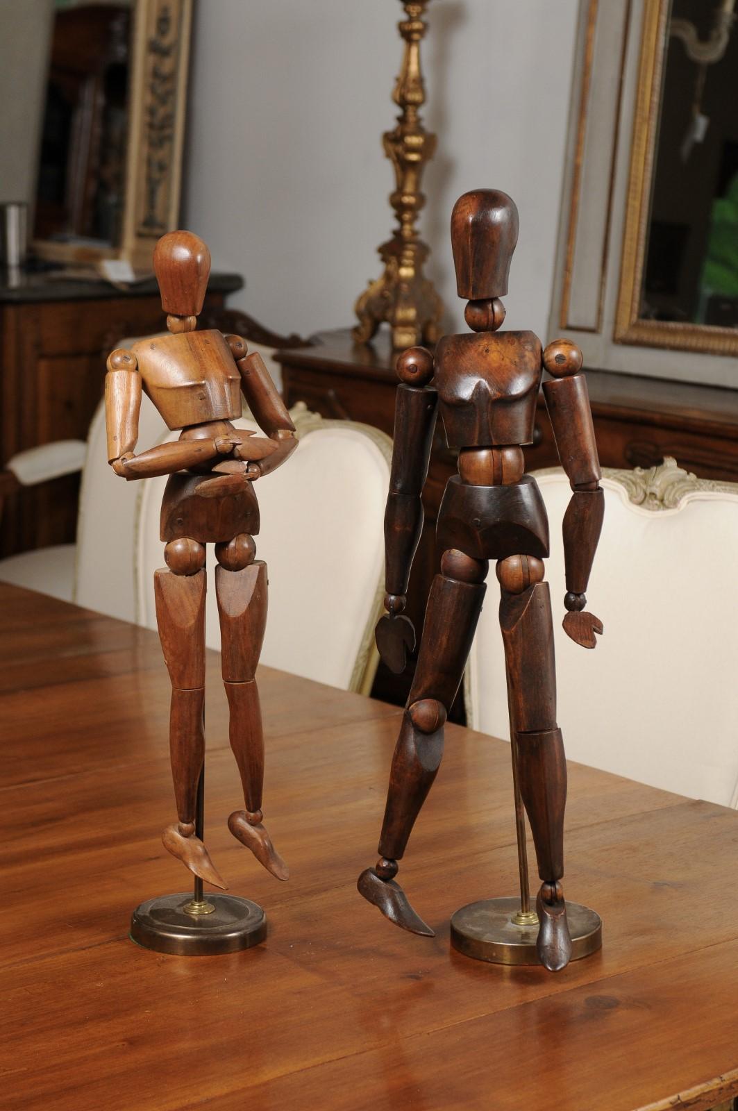 Two English artist's wooden articulated lay figure from the early 20th century, mounted on custom bases and priced $950 each. Created in England during the 20th century, these wooden pieces are reminiscent of the practice, common during the
