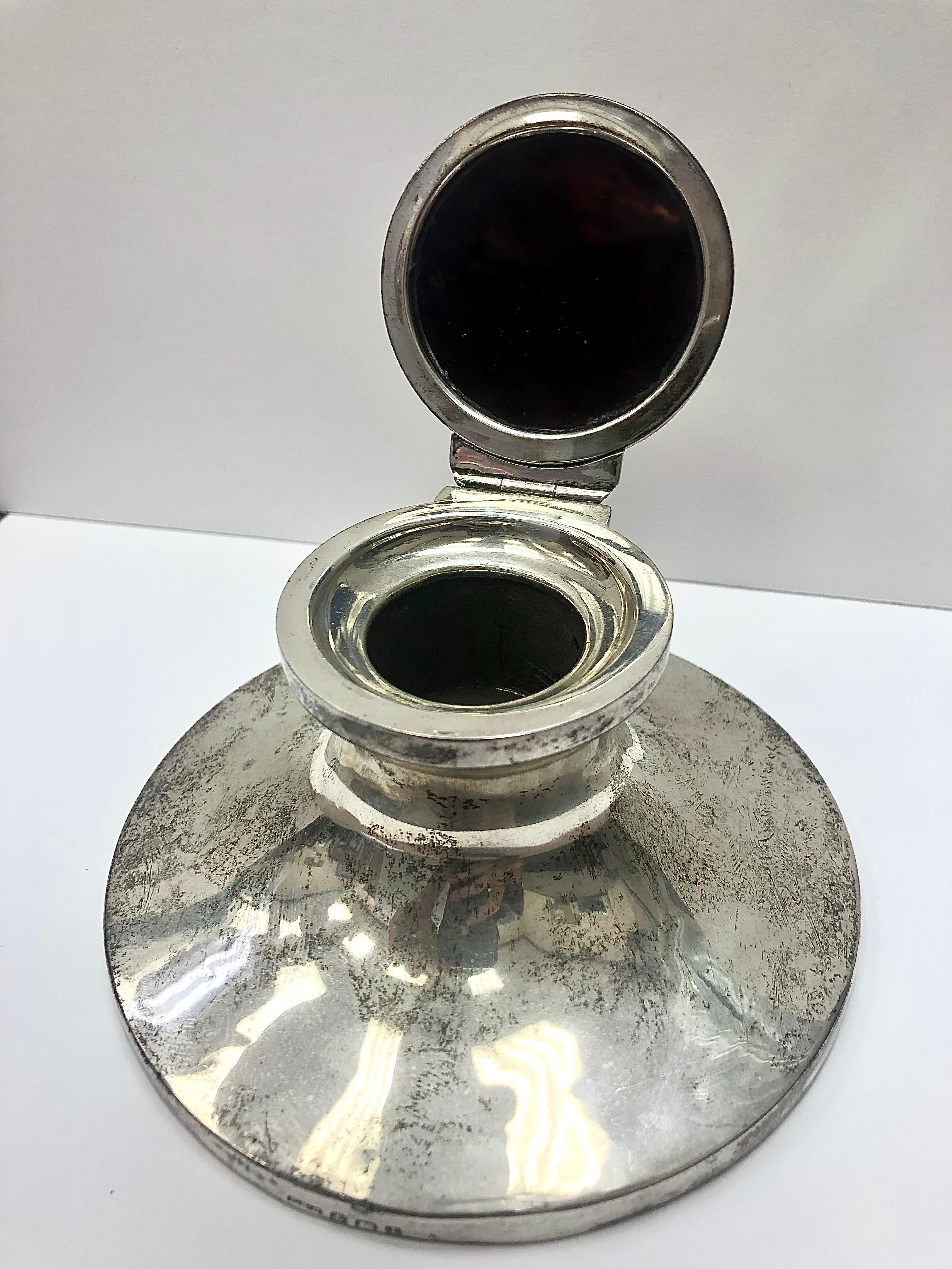 Stunning sterling silver inkwell with an inlaid tortoise shell lid. Circa 1912. Glass liner is missing.