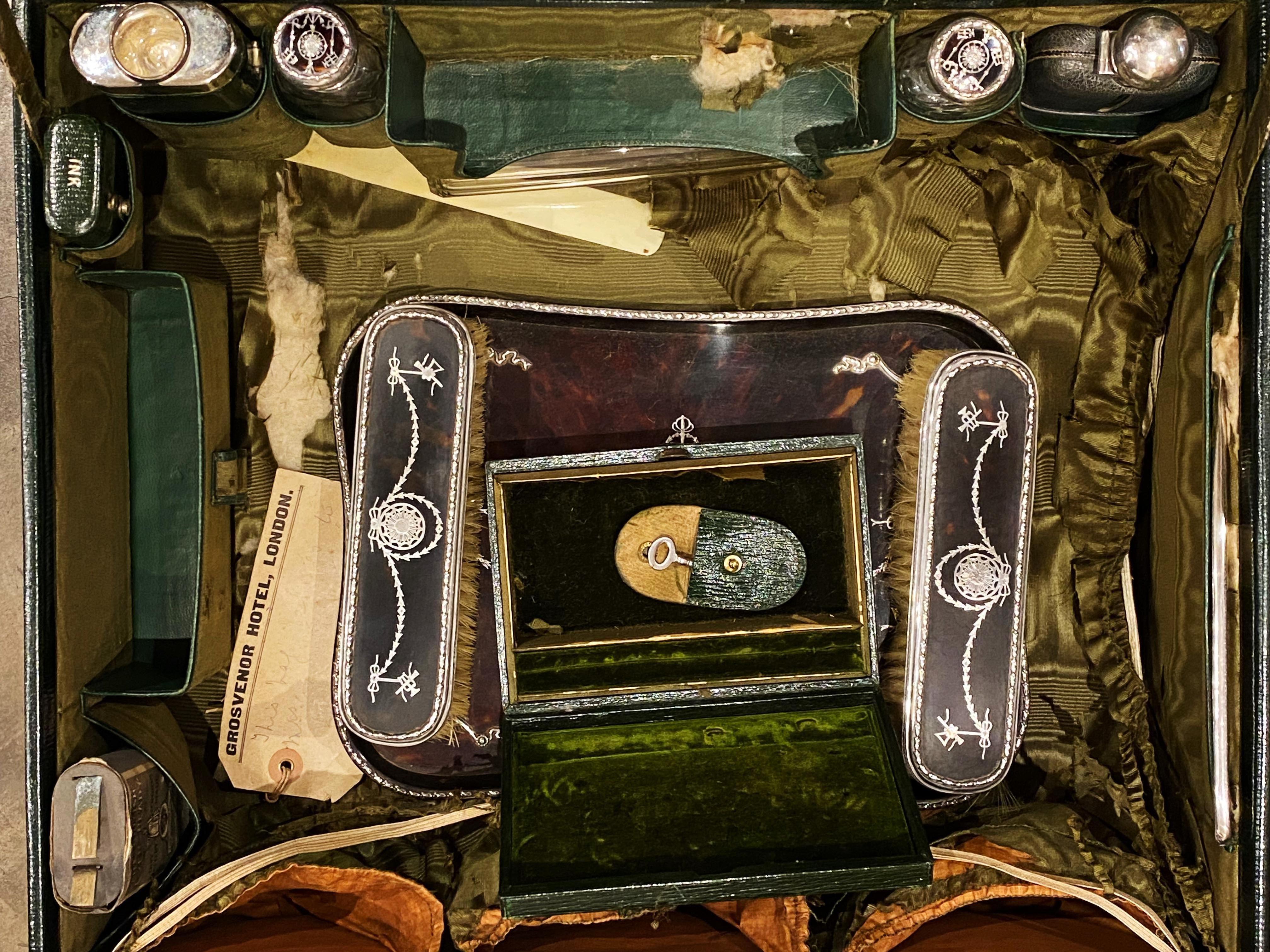 This Antique Edwardian early XXc (circa 1907 - 1915) 
Travelling Vanity Set / Dressing Table Set 
in its original shagreen leather suitcase is a rare find!

It’s a fascinating piece of the early XX century history of England

It’s performed in Faux