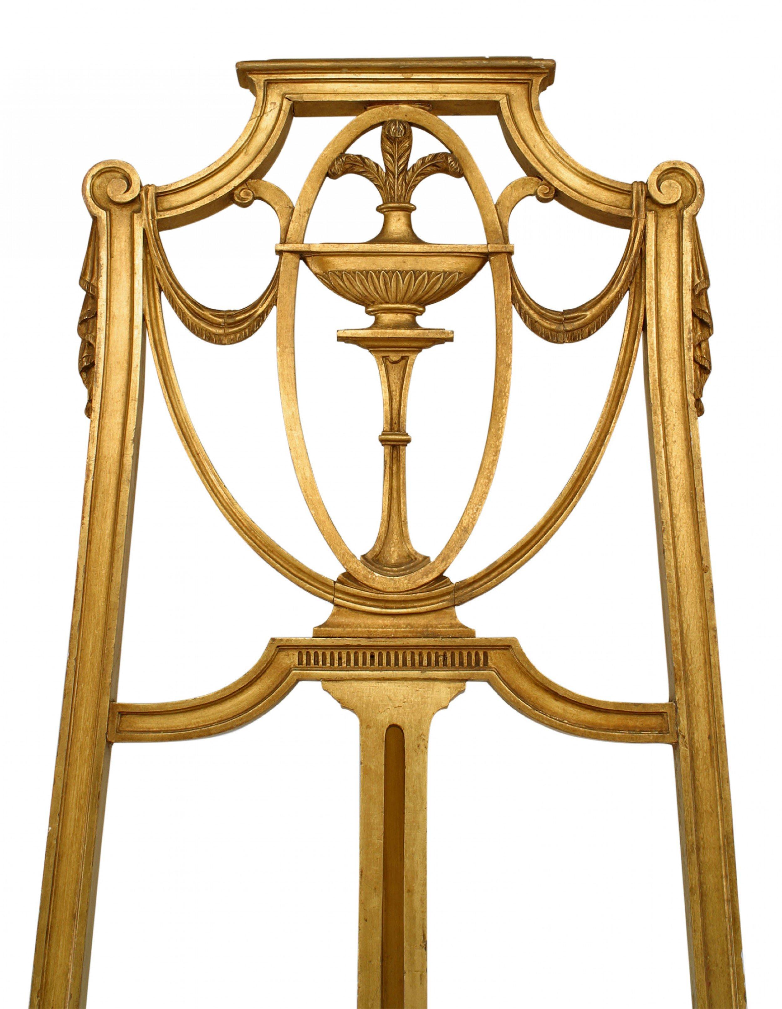 English Adam style (19th Cent) gilt easel stand with carved swag and plume top.

Condition: Good; Wear consistent with age and use