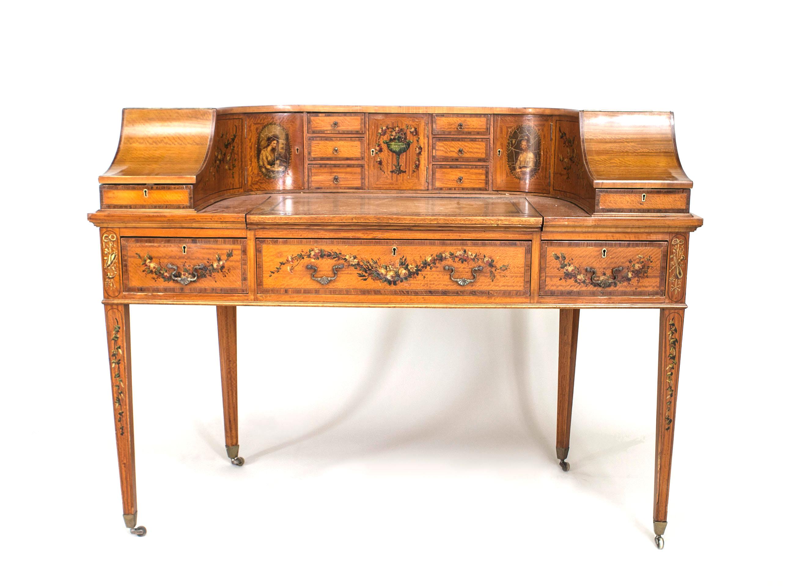 19th century English Adam style satinwood Carlton House design desk with painted floral decorative trim and green leather top.