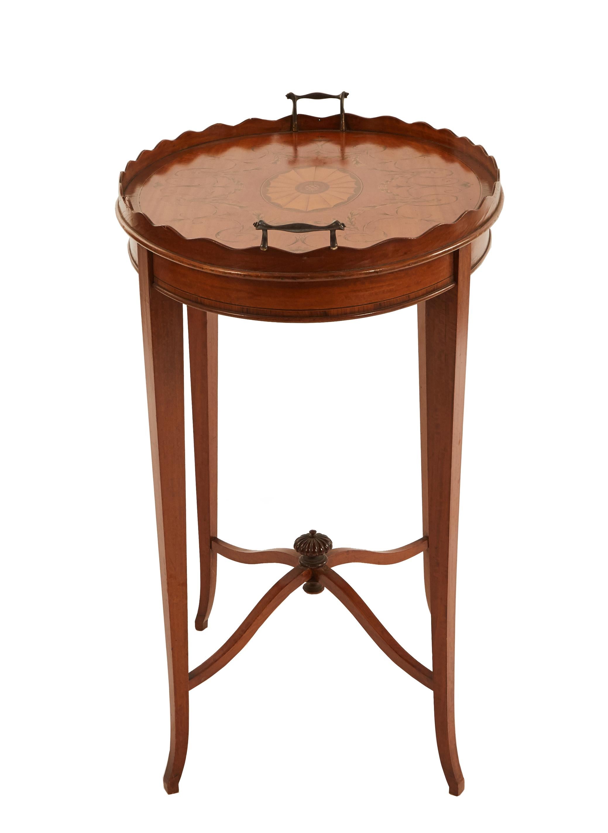 19th century English Adam style satinwood oval end table with inlaid medallion on top and scalloped gallery with silver handles and a stretcher supporting finial.