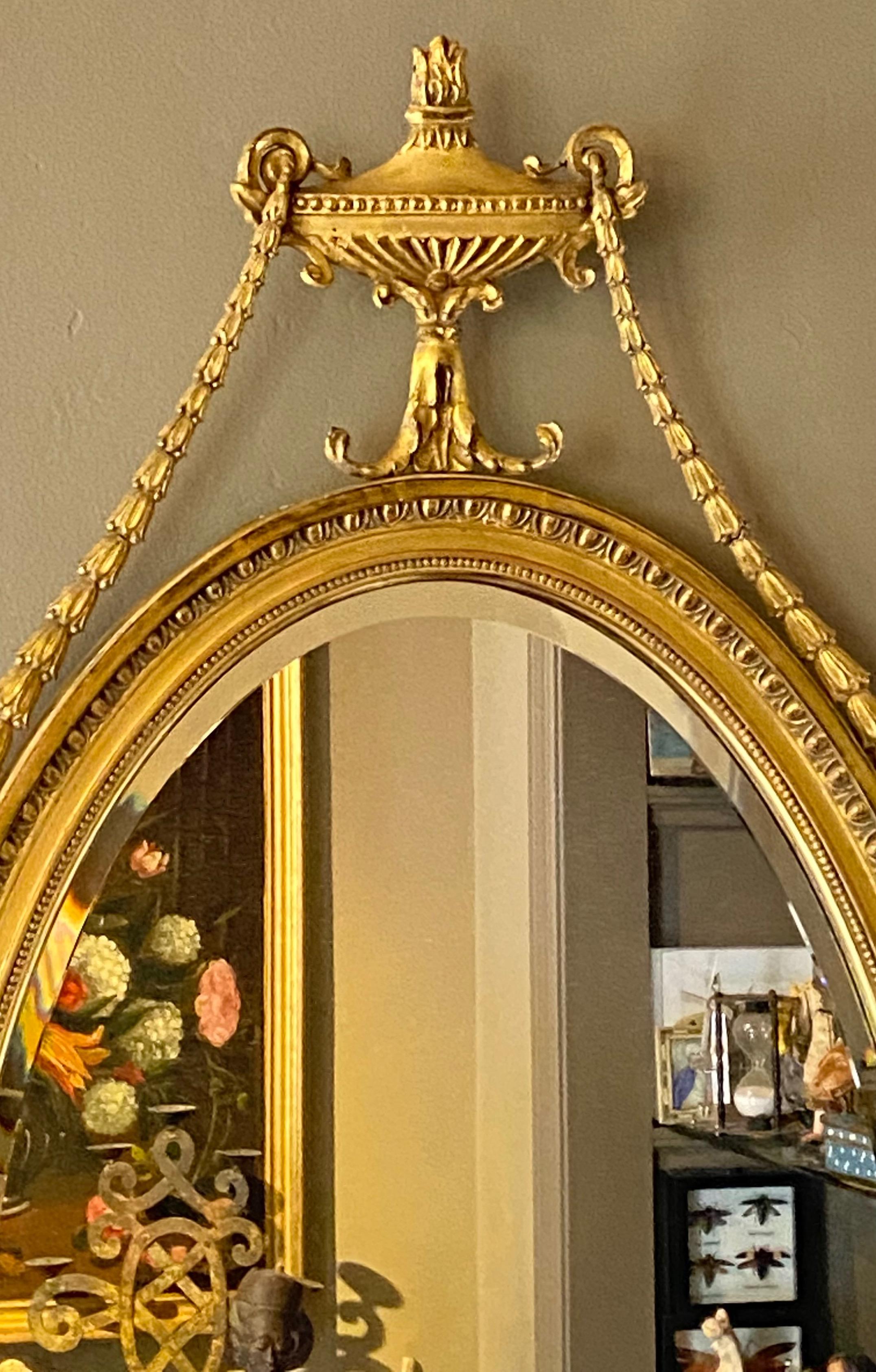 Carved English Adam Style Oval Gilt Mirror, Early 20th Century For Sale