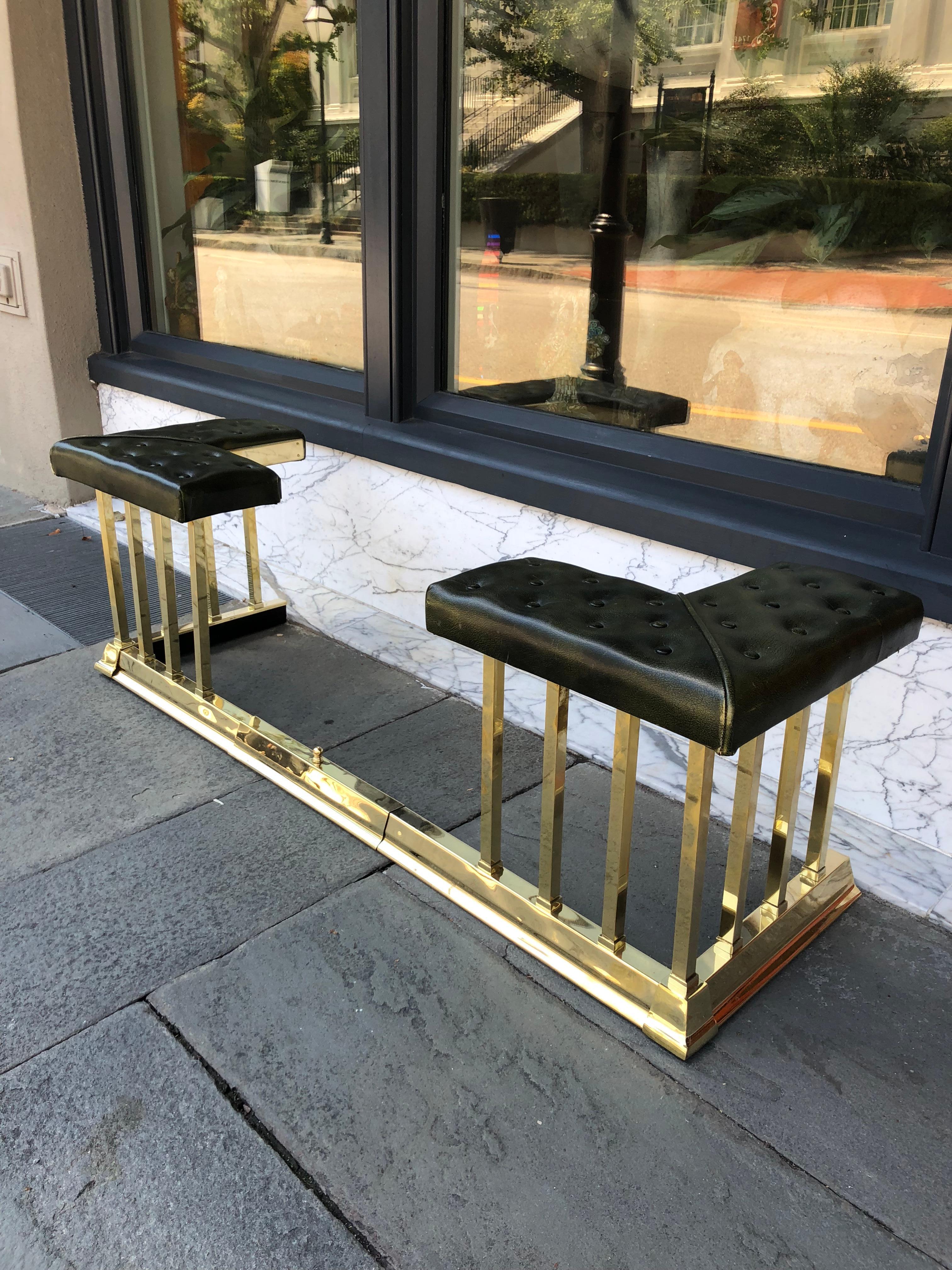 English adjustable club fender brass with leather tufted cushions.