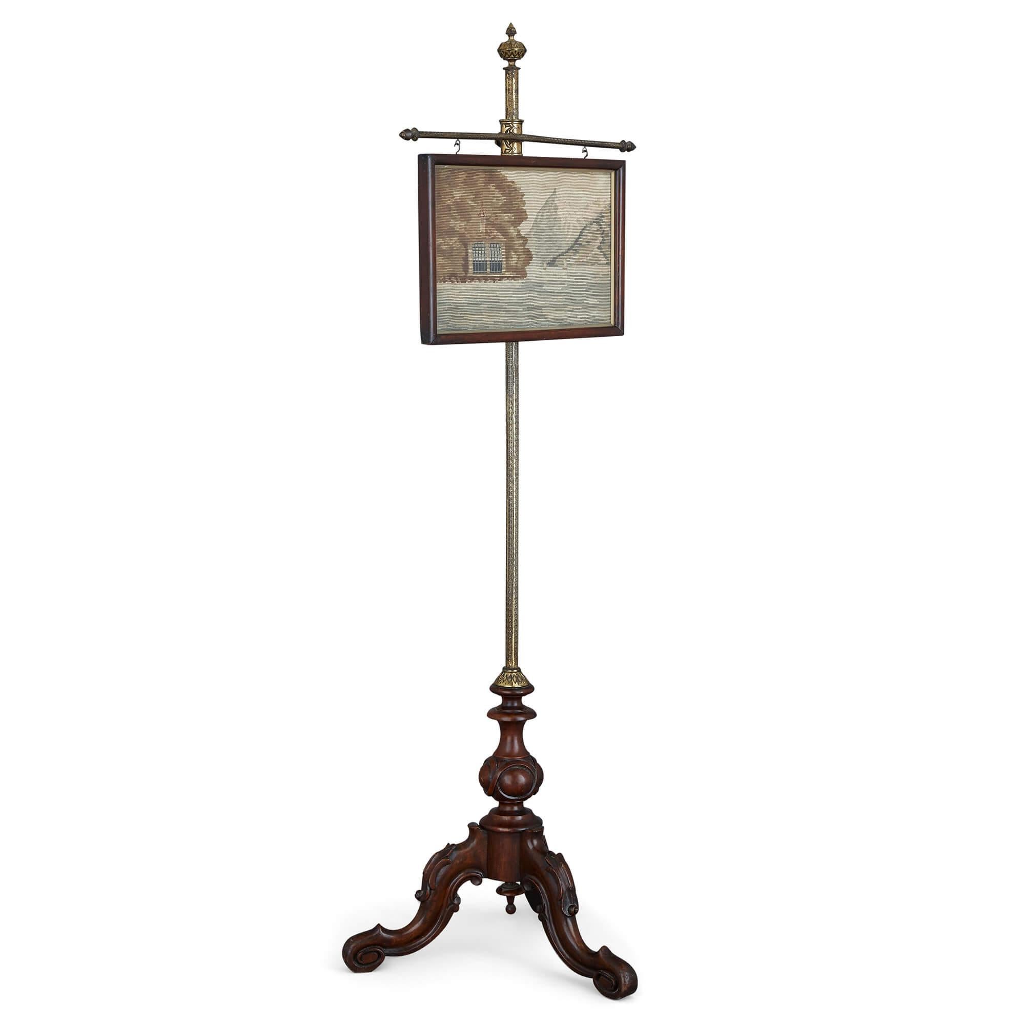 English adjustable tapestry and mahogany fire screen
English, c. 1860
Measures: Height 138cm, width 45cm, depth 40cm

This mahogany and gilt metal fire screen is supported on a wooden tripod base with an ornately decorated gilt metal stem. The