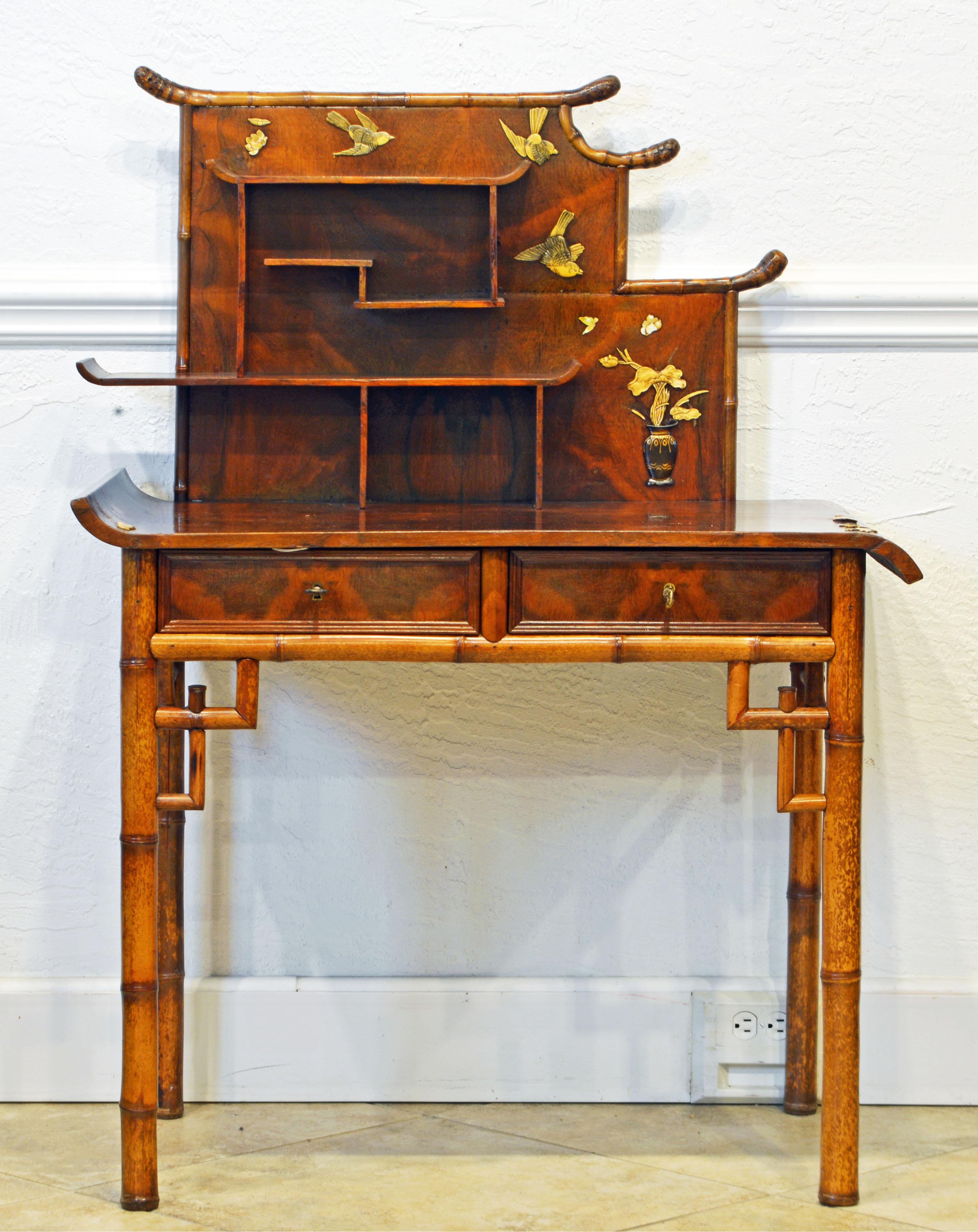 This unique English bamboo and figured walnut secretary desk combines traditional chinoiserie style with the late 19th century's new trends of the Aesthetic movement. The desk top has up swung and down swung ends, the shelves are organized in an