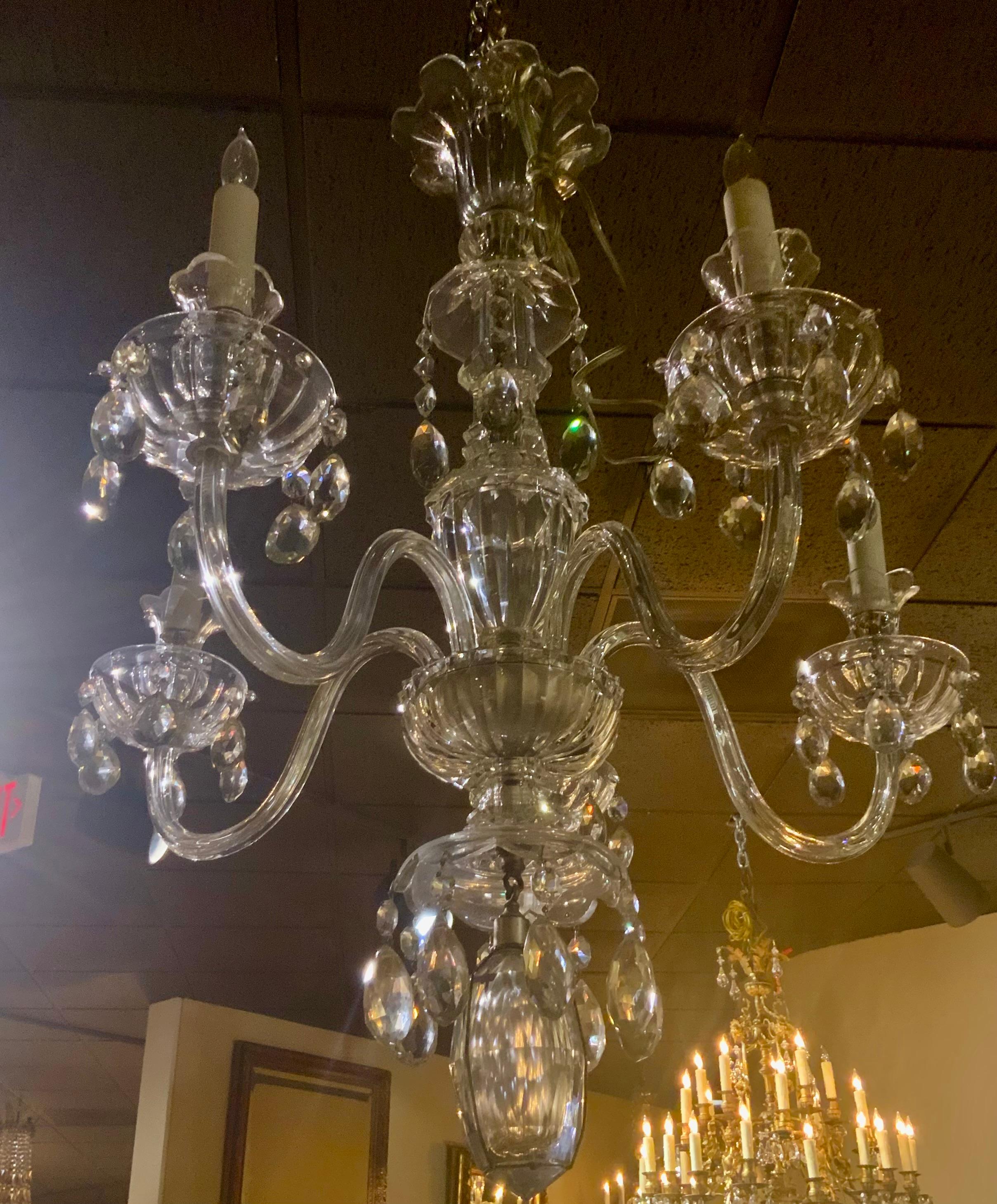 The exceptional crystal that is in this piece makes it very
Special. It has five scrolling arms with a long crystal stem.
It has a special elongated crystal piece at the base of this
Chandelier. 