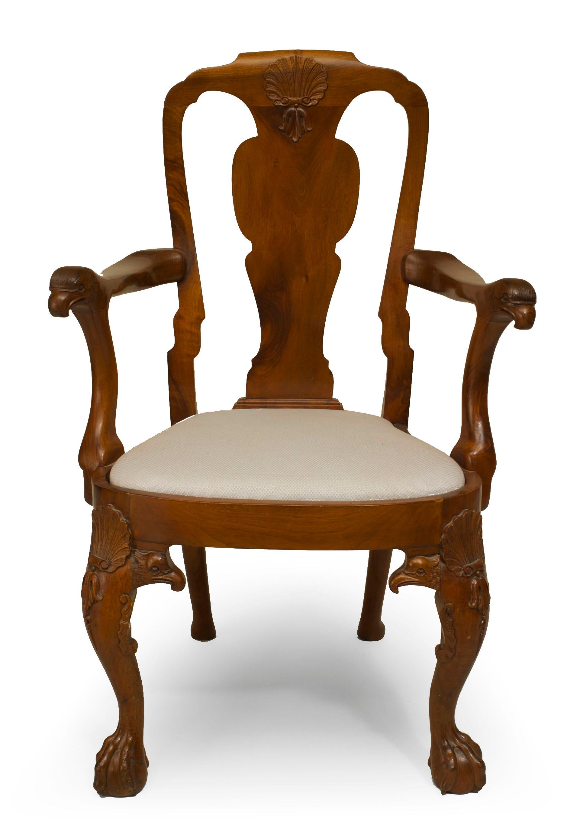Pair of late 18th Century English Anglo-Indian George II padouk arm chairs with balloon slip seats and bellflower carved knees with a splat back having a decorative shell crest and bird head arms