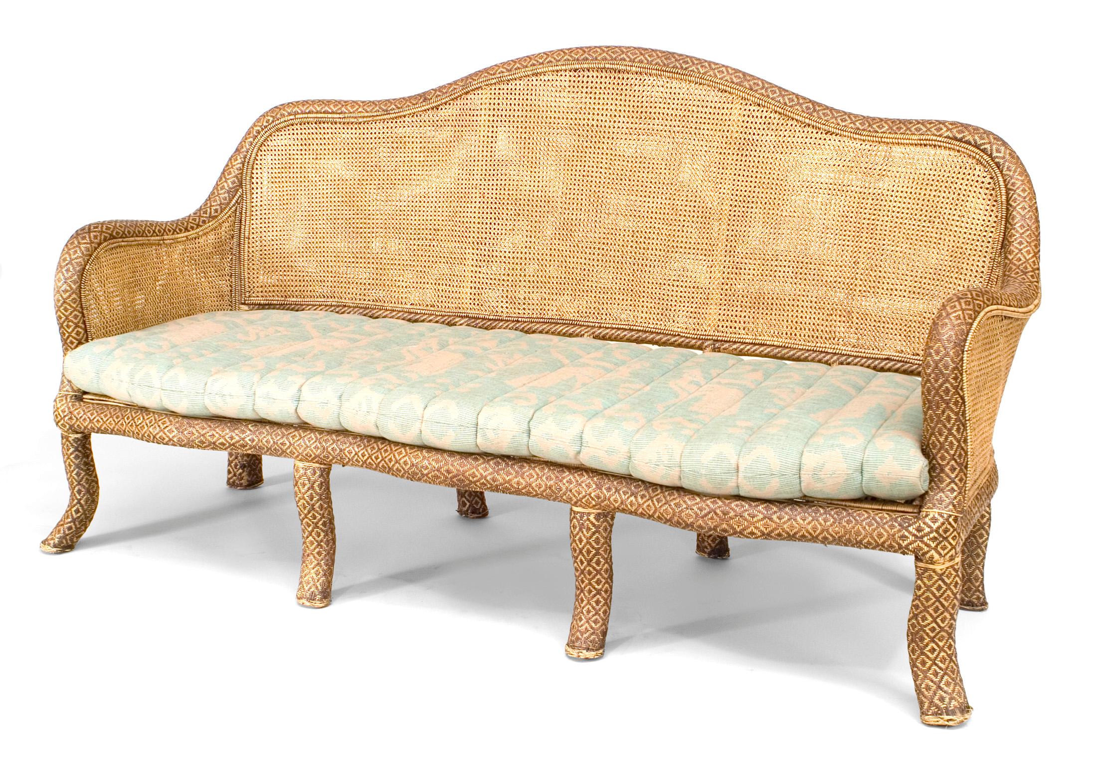 English 'Anglo-Indian style' natural wicker settee with shaped back and cane seat and back, 20th century.
 