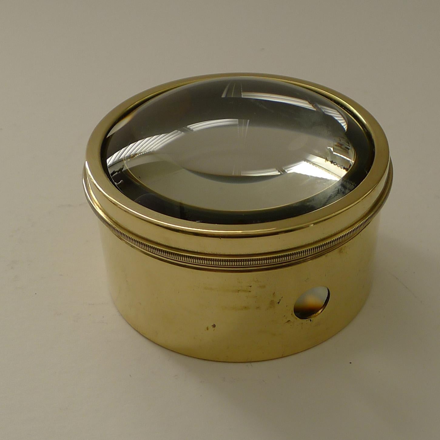 Always very popular and a very useful desk-top accessory. 

These circular magnifiers actually are the condenser or magnifier from a Magic Lantern dating to around 1910 they are rescued, polished up and put back to use in the modern day.  

This one