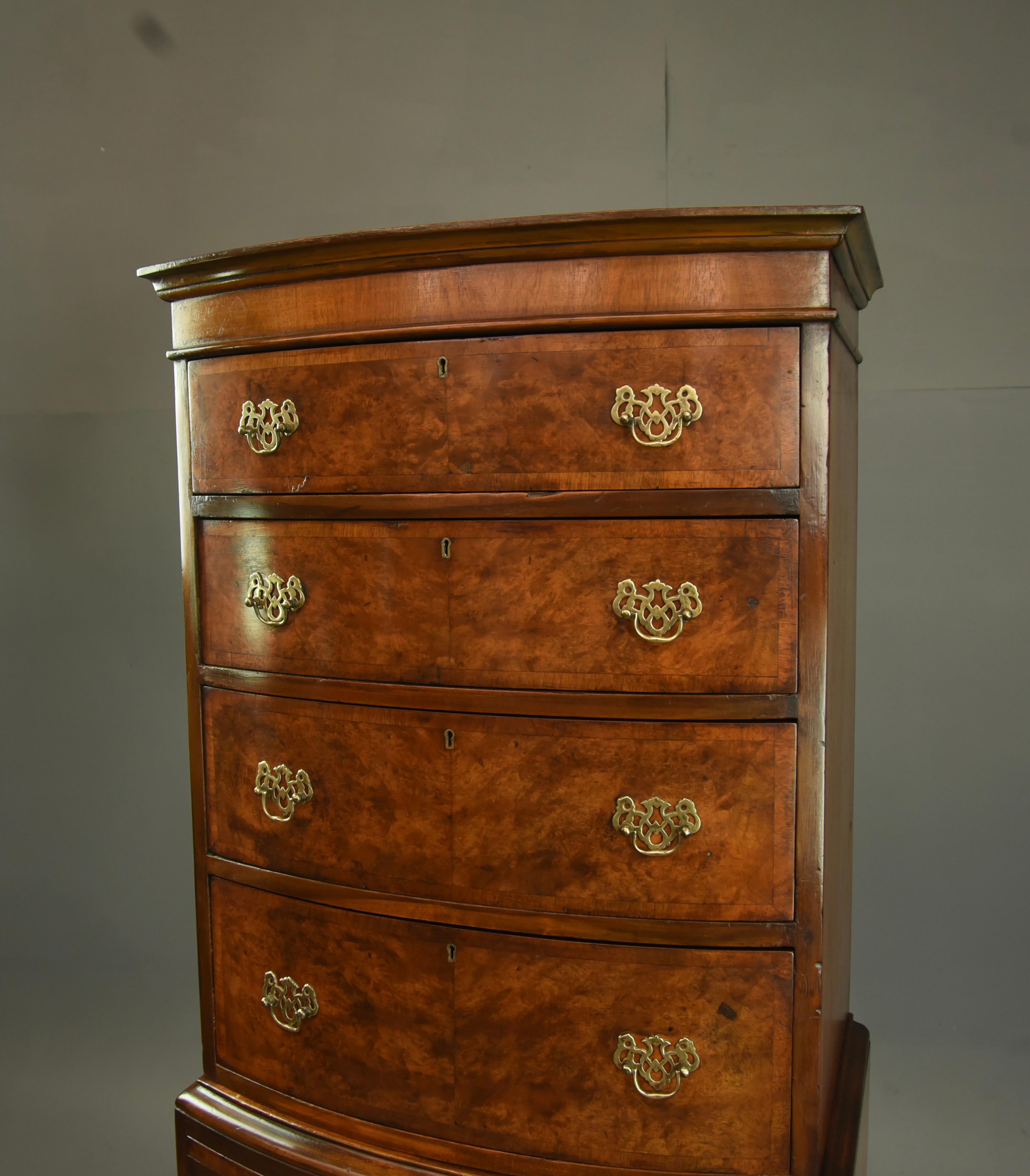 This is a fine quality burr walnut bow front chest of drawers tall boy circa 1900.
The chest consists of 7 graduating drawers that are oak lined with fine hand dove tails ,all drawers are solid clean and slide nice and smooth as they should ,there
