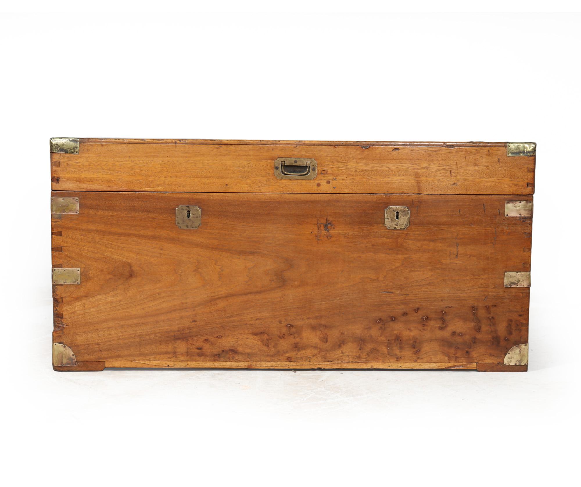 English Antique Camphor Wood Box 

The elegant and sturdy camphor wood box from the late 1800s not only boasts exquisite brass fittings but also offers practicality and charm to any space it graces. Its military-style handles make lifting a breeze,