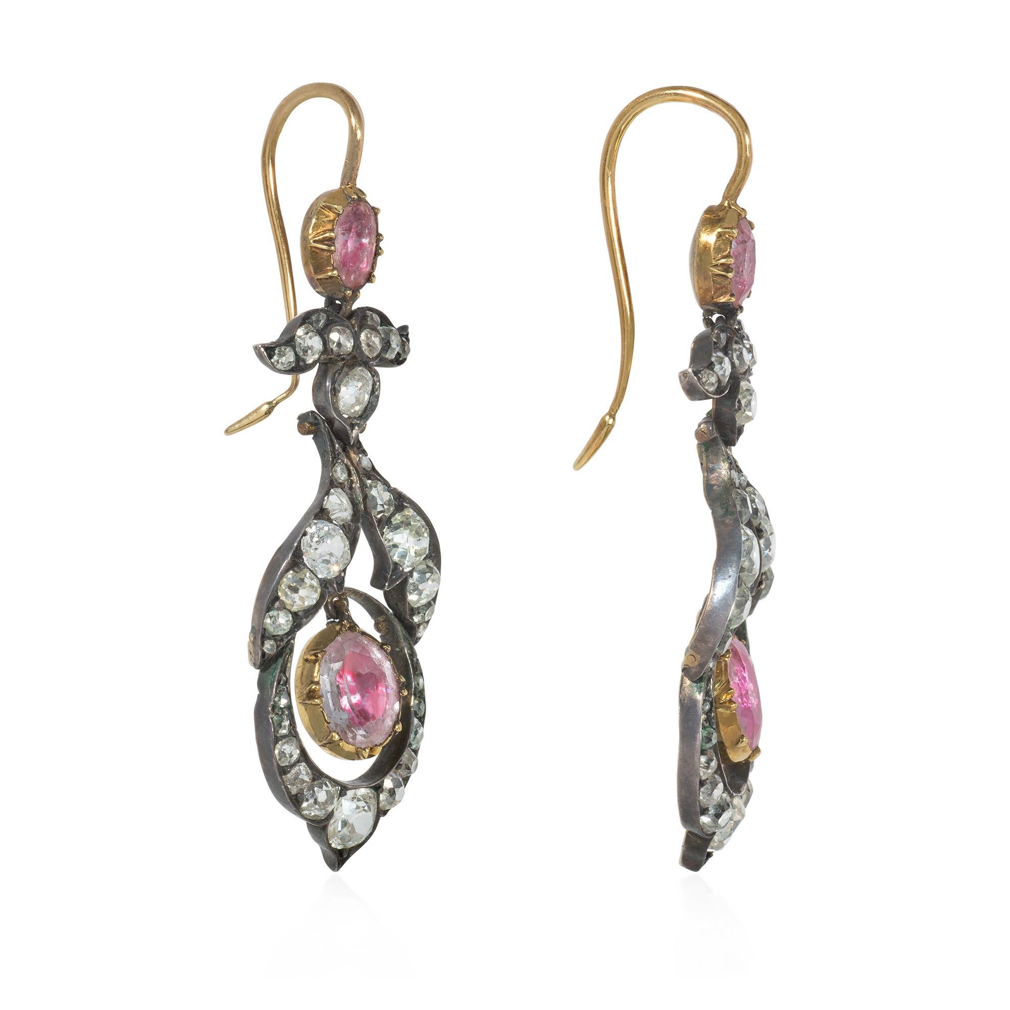 A pair of antique Georgian period old-mine diamond and foiled pink topaz pendant earrings of foliate design, in sterling silver and 15k gold.  England.  Atw diamonds 3.50 cts.

* Includes letter of authenticity for insurance purposes
* Free