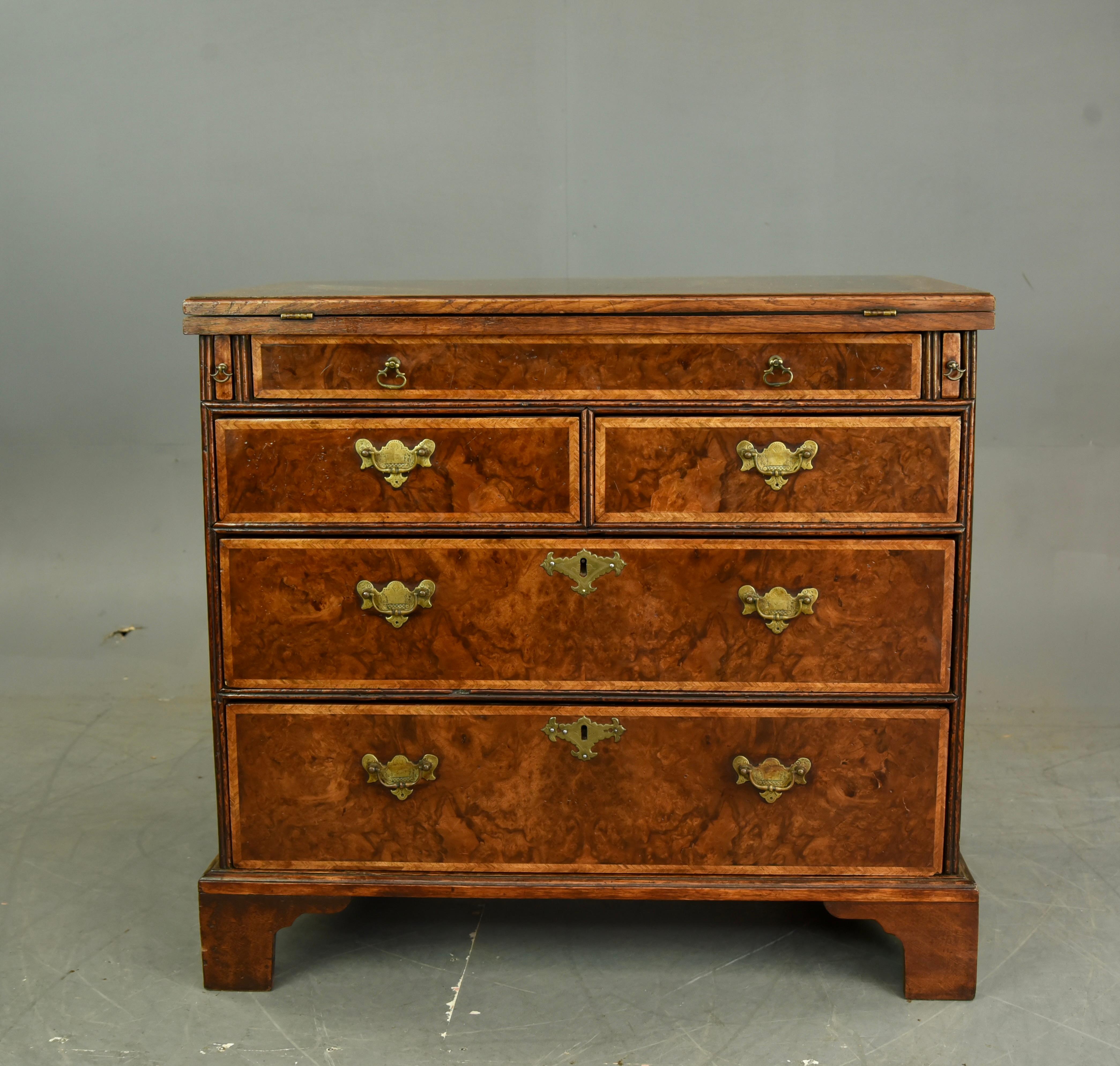 Wonderful Antique Georgian burr walnut bachelors chest of drawers .
The chest  has 5 oak and pine lined drawers with brass engraved plate handles (not original but early replacements ) ,it has a wonderful burr walnut grain and colour ,with a flip
