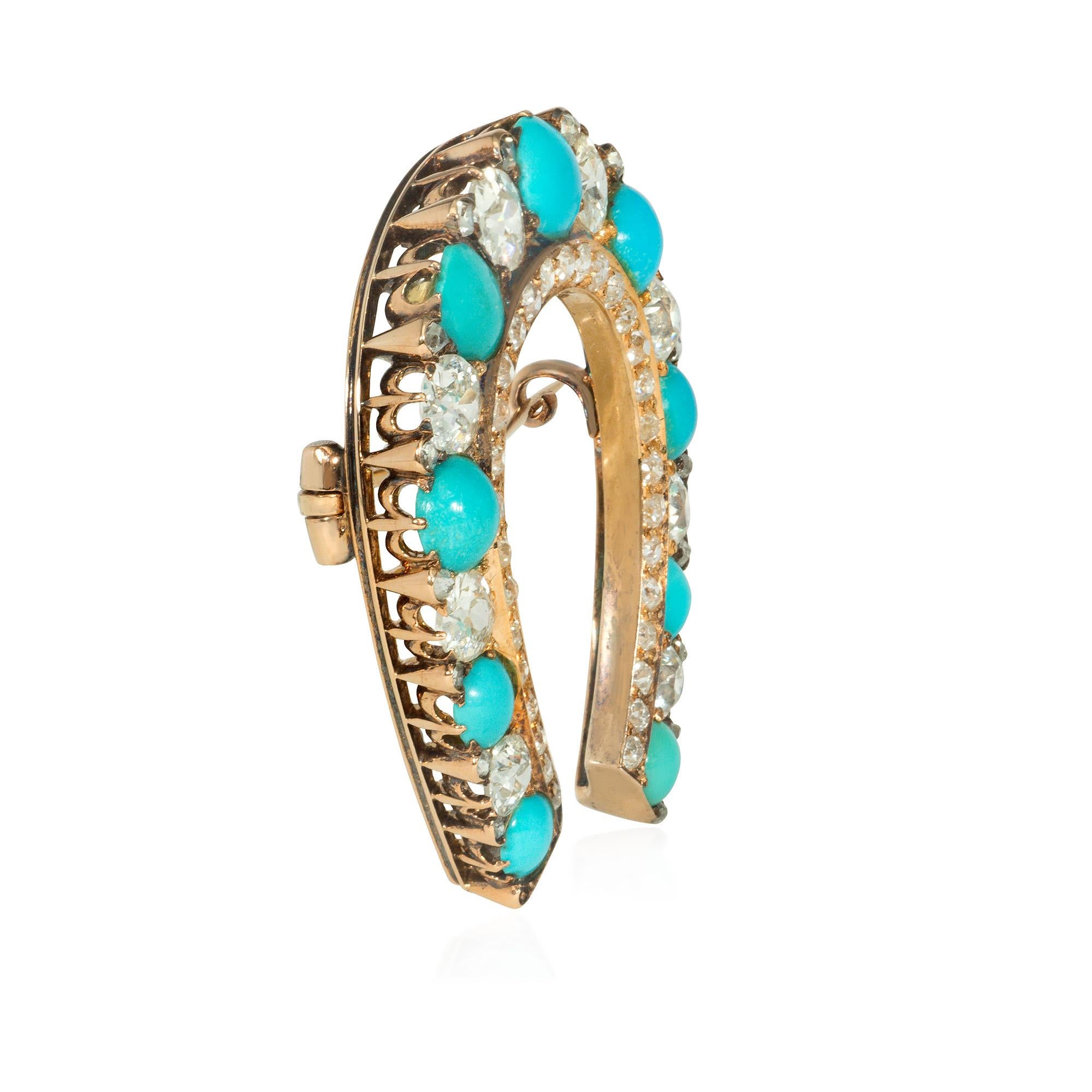 A Victorian diamond and turquoise horseshoe brooch set with graduated and alternating old mine cut diamonds and cabochon turquoise, with rose cut diamond inner border and accents on the outer border, in 15k gold with pierced gallery.  England.  Atw