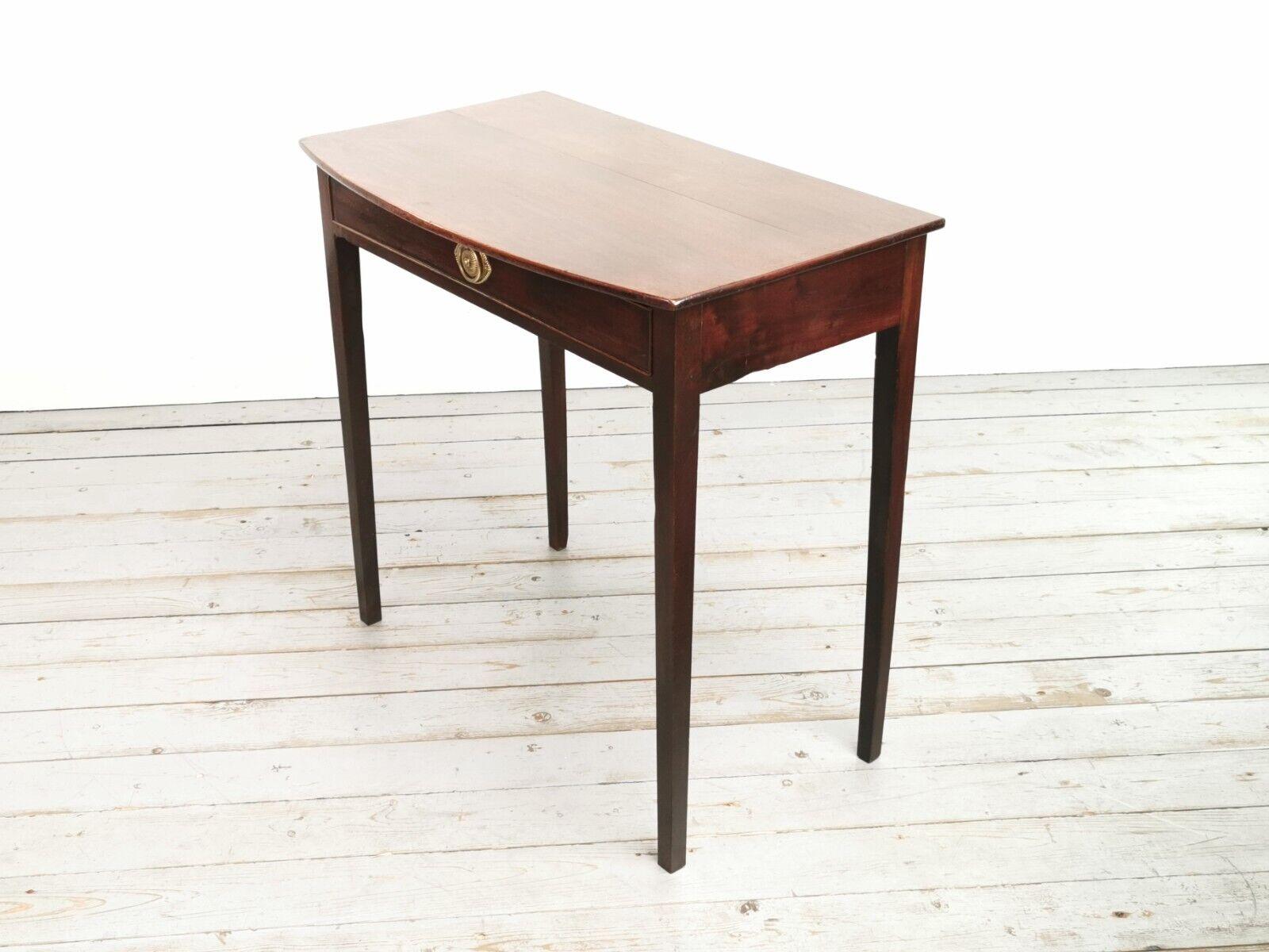 Antique Side Table

Early 19th century English compact side table or writing desk.

Made from mahogany, the drawer features a brass drawer pull, and the oversailing bow fronted table top is raised on tapered square legs.

Dimensions (cm):​ ​

77 H x