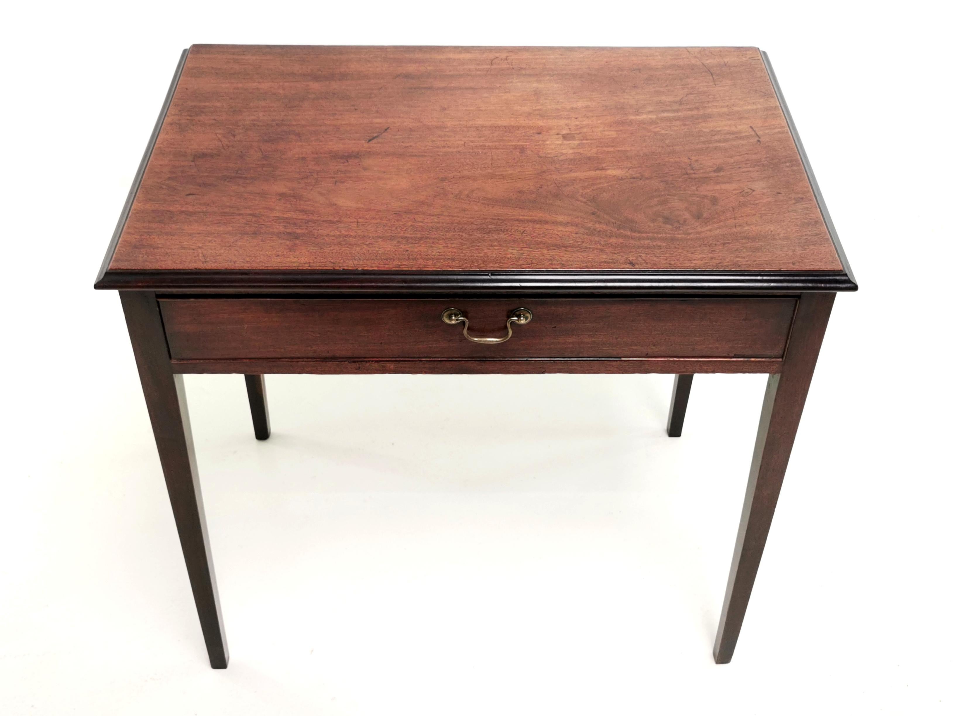 19th century Georgian side table

An early 19th century mahogany side table with a single drawer with cockbeaded borders, raised on square section tapering supports.

Ideal as a writing desk.

Dimensions (cm):? ?

72 H x 77 W x 50