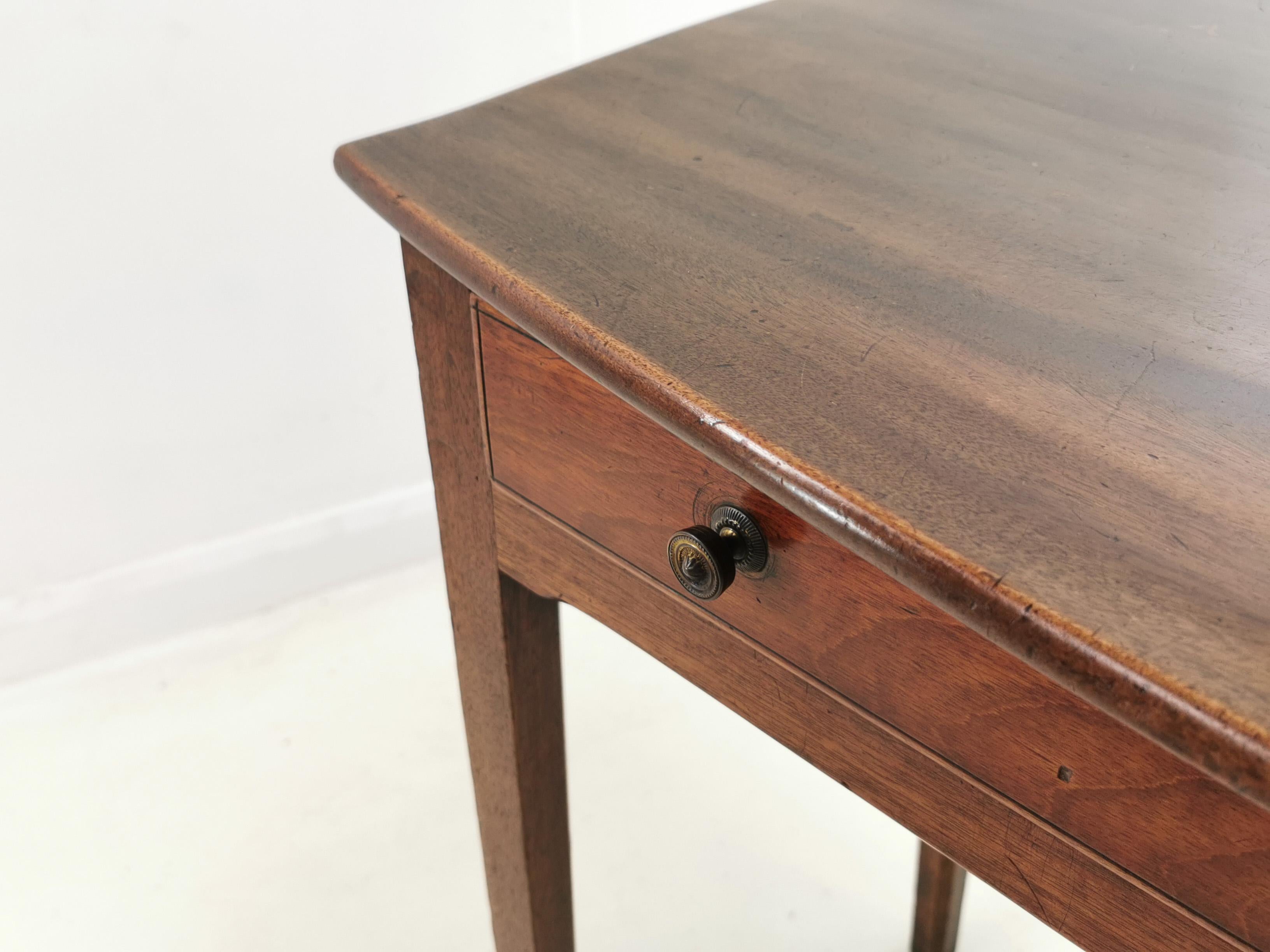 Georgian side table

Georgian mahogany side table or writing desk. Single drawer fitted with detailed brass knobs. Raised on square supports.

A very nice example of a simple Georgian design which we have decided not to renovate due to its