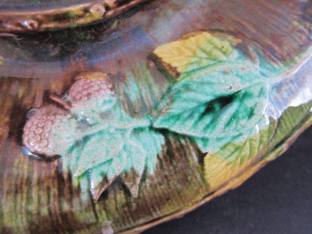 English antique Majolica bread dish with berry and leaf decoration.