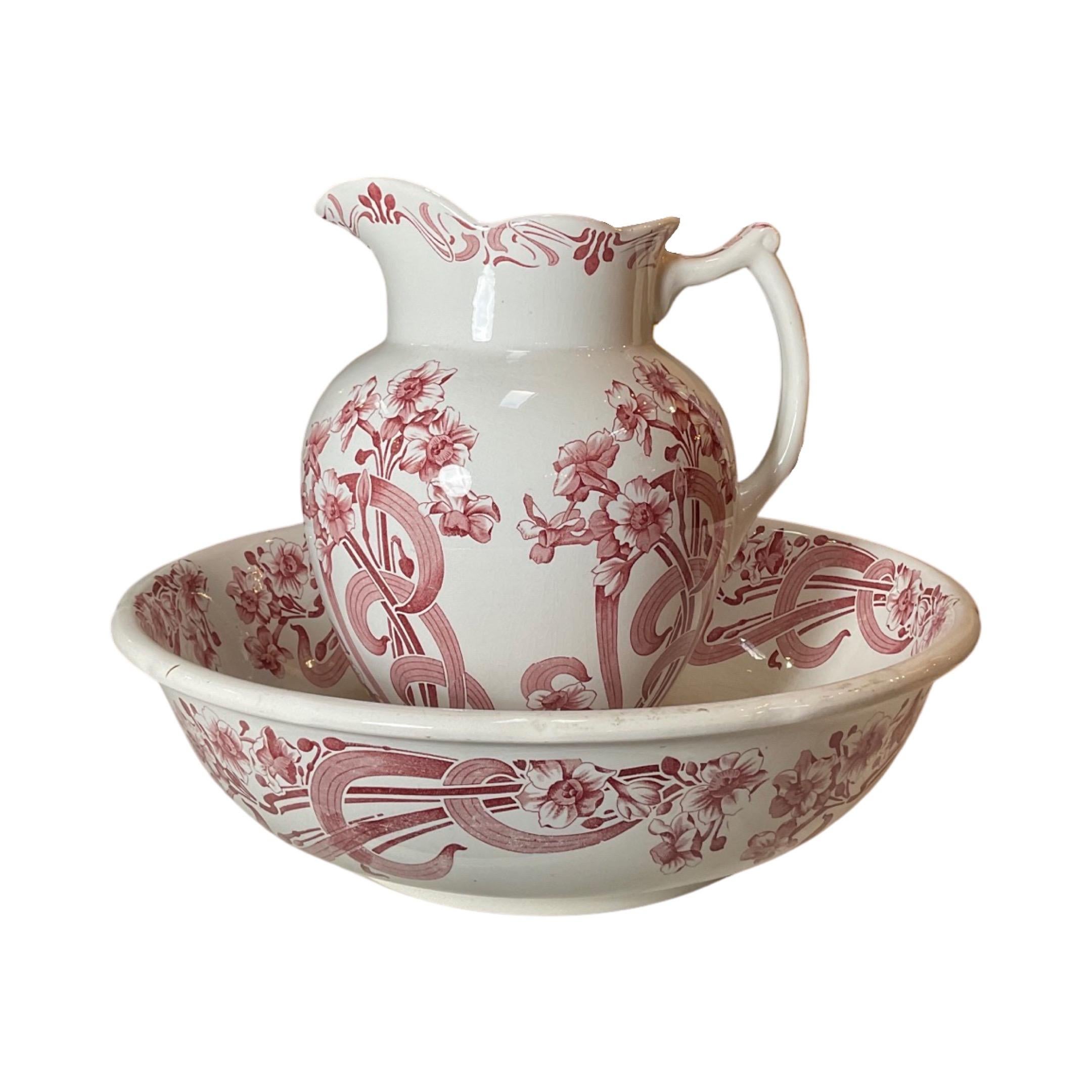 Enhance your collection with this stunning 19th century English Antique Porcelain set. Featuring delicate floral prints, this 2 piece set includes a pitcher and bowl, perfect for showcasing your refined taste. Crafted with intricate detail, this set