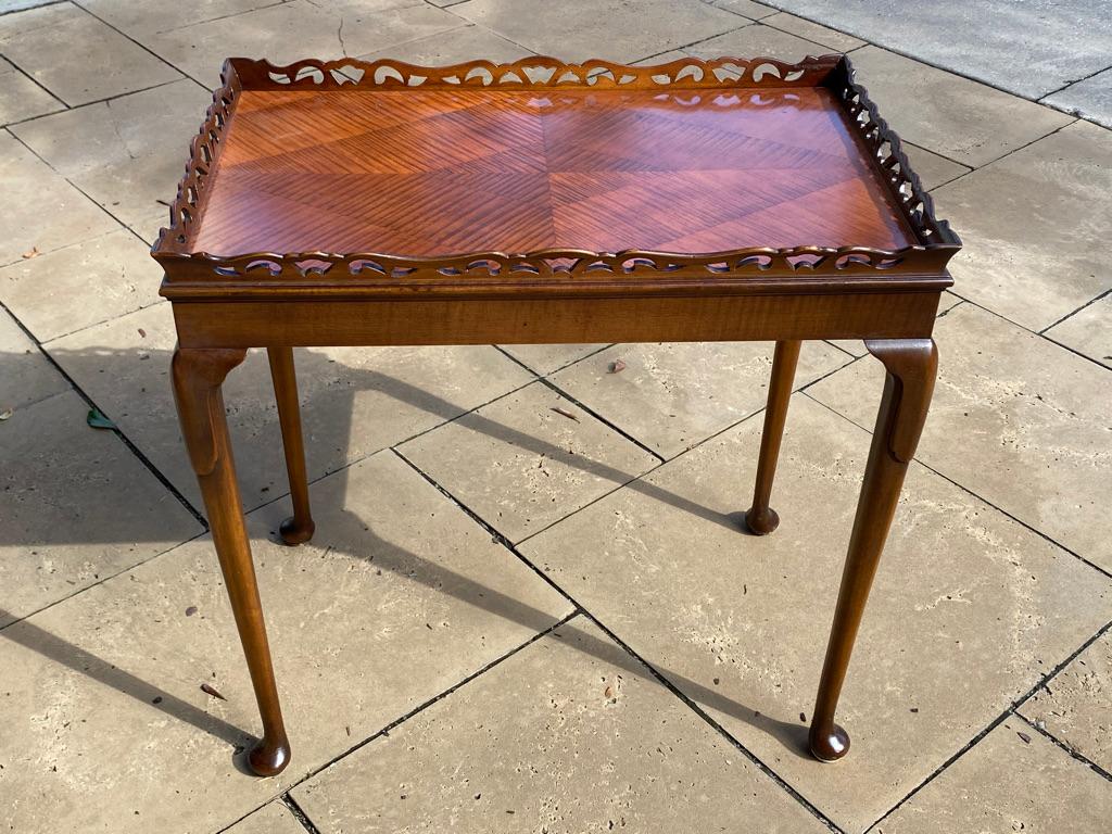 This antique satinwood side table has a design of 4 pieces inlaid wood pattern to the top with a pierced gallery surround with queen ann padded feet well done.