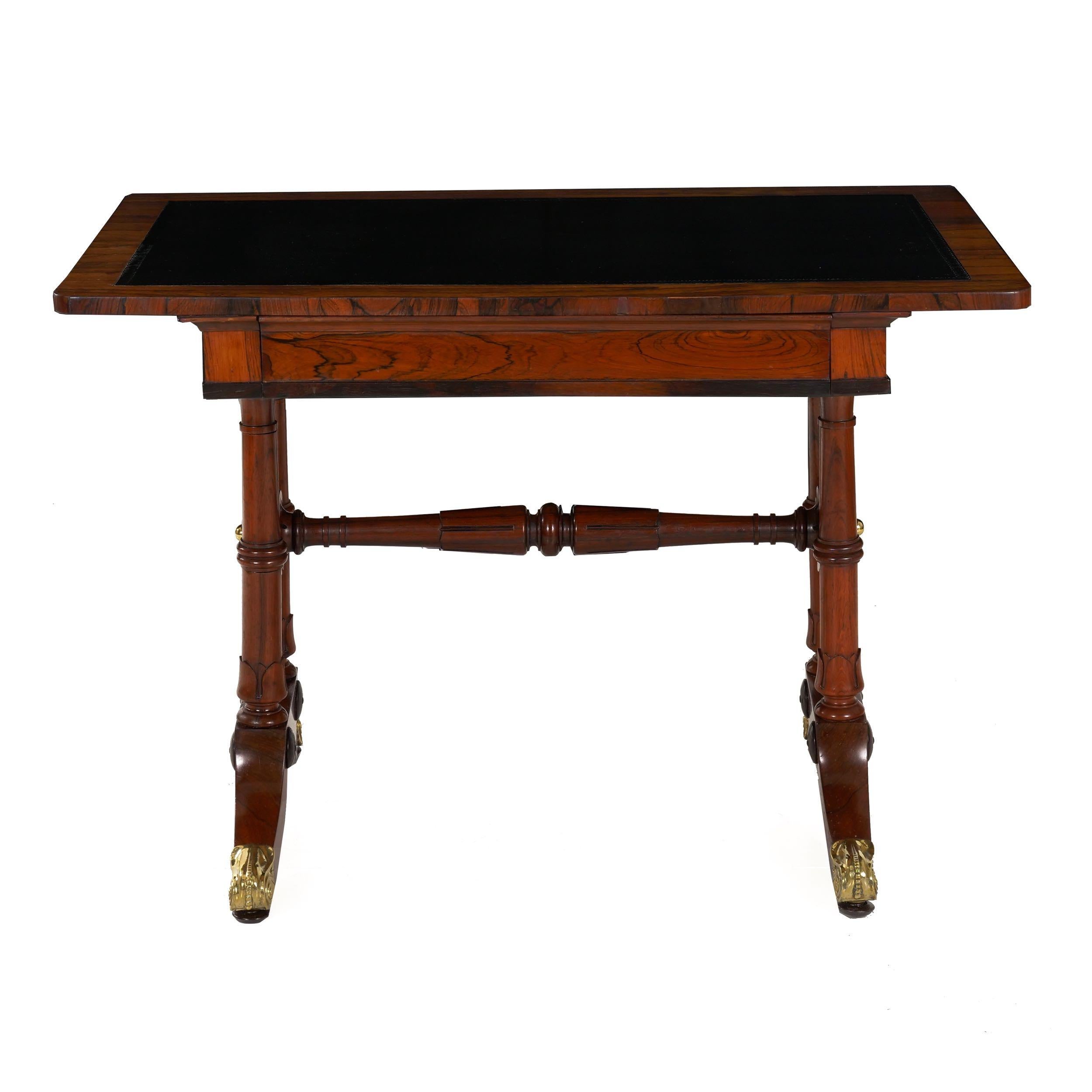 WILLIAM IV rosewood leather-top writing table
of small proportions with single drawer; England, circa 1835
Item # 007NZP30K 

This unusual writing table of the William IV period is of noteworthy dimensions, allowing the slight table to serve as