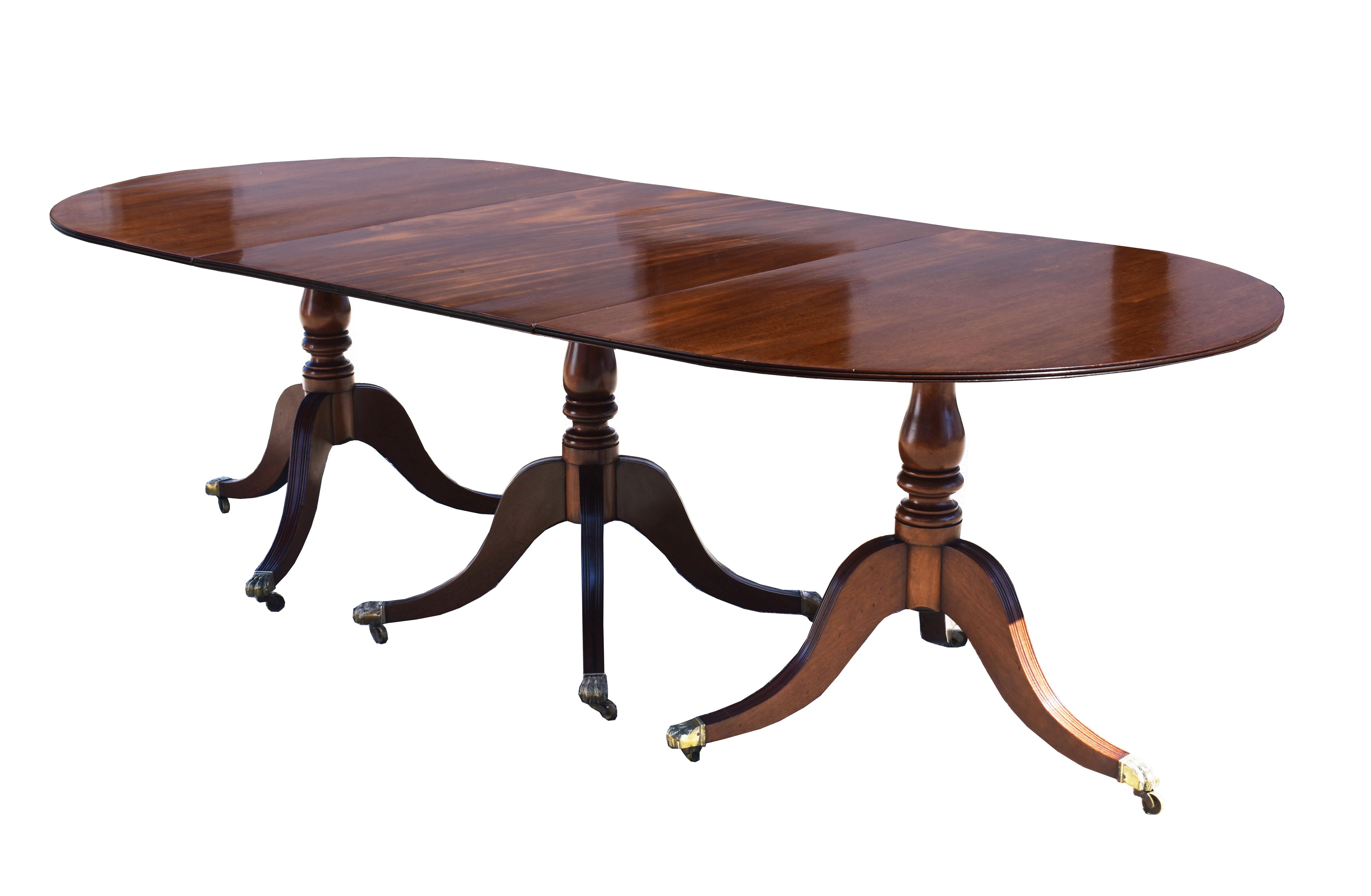 For sale is a good quality antique Regency style mahogany pedestal dining table. The tops supported by four pedestals. The table can be used with all four pedestals and leaves for maximum length, or can be reduced by removing pedestals and leaves to