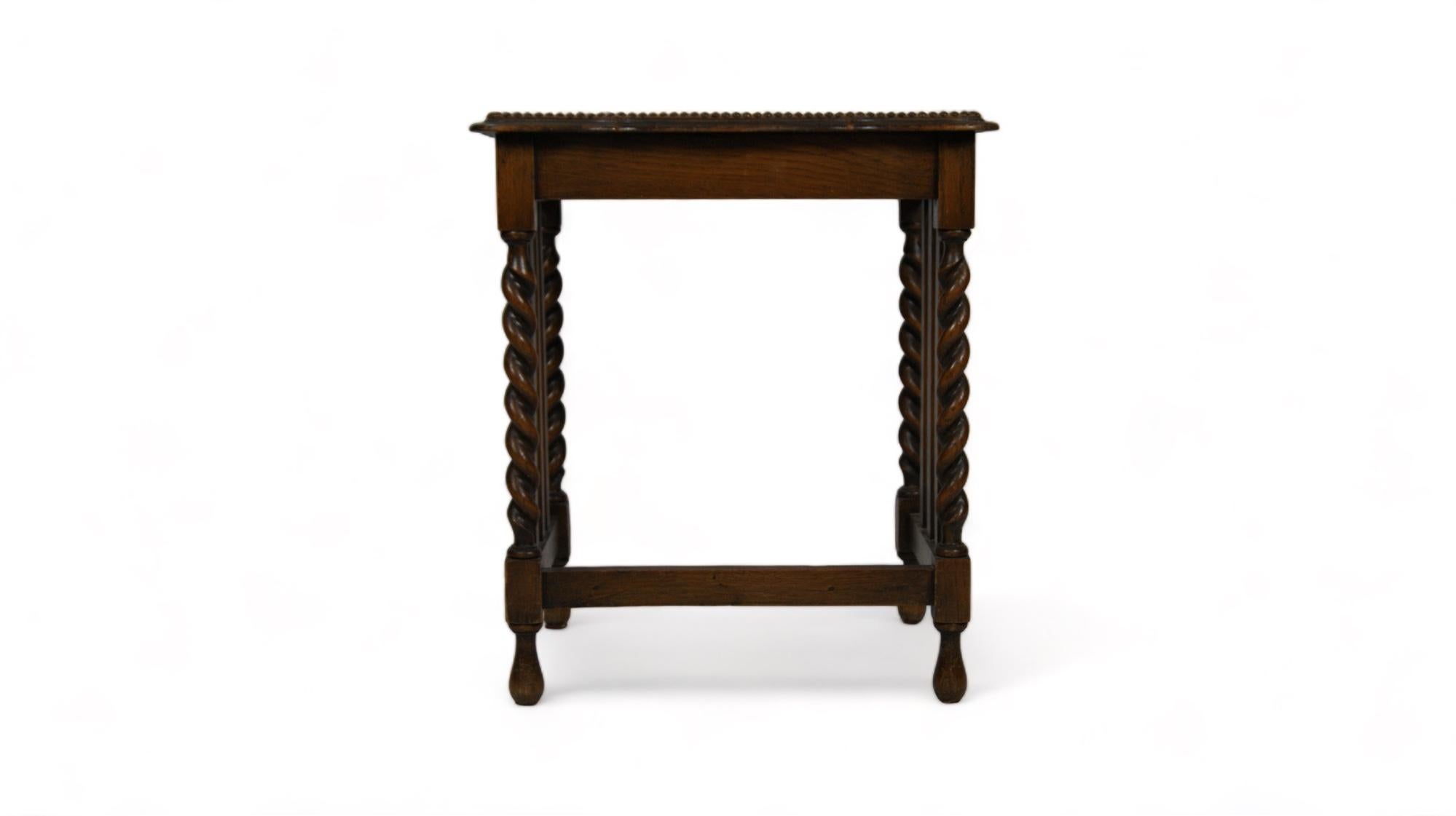 The vintage side table with twisted legs, dating from the 1920s, is an exquisite treasure that evokes the essence of a bygone era of elegance and refinement. This unique piece of furniture merging functionality with style.

The body of the coffee