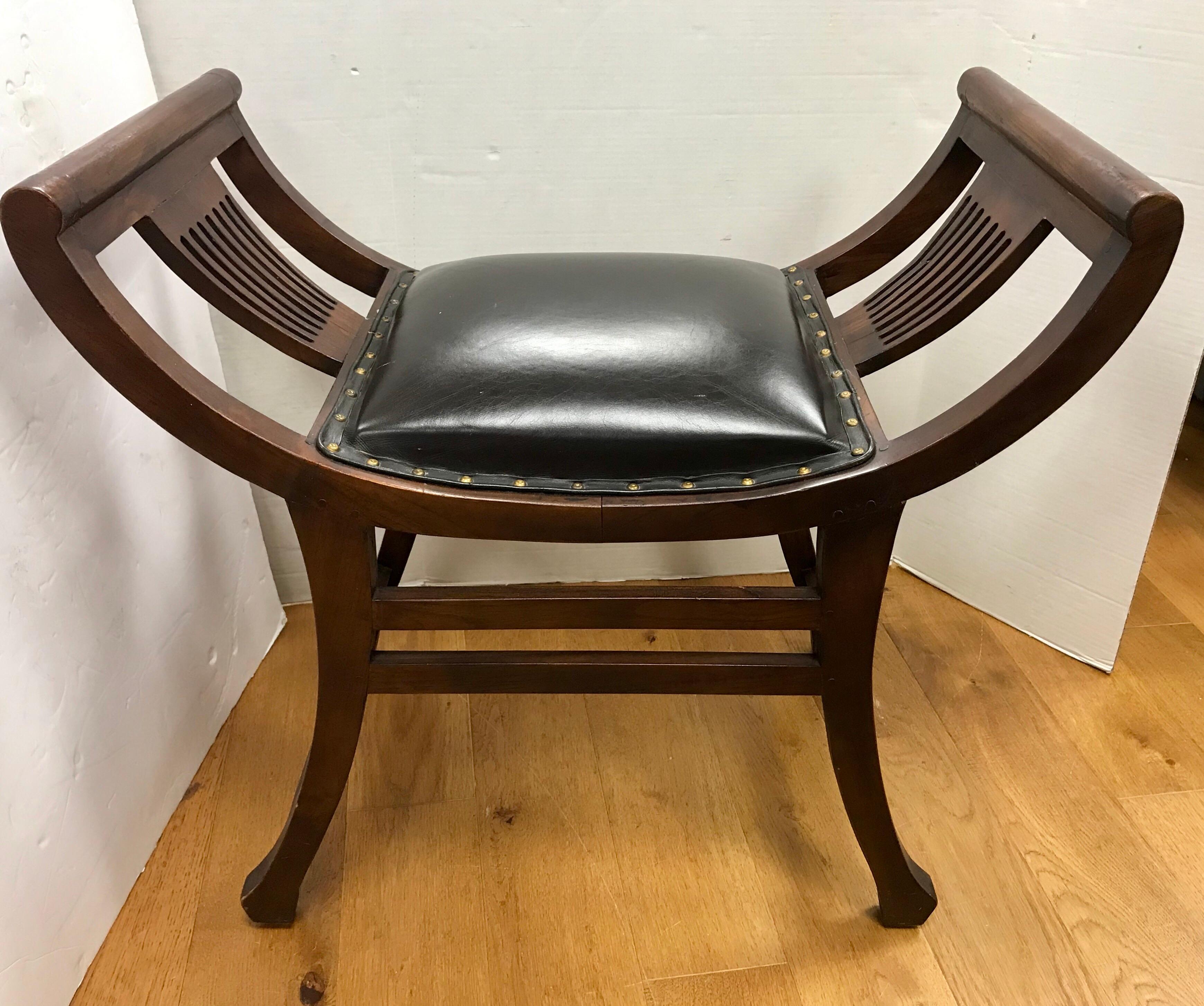 Coveted English leather slatted bench or stool with black leather seat and studs. They are supported with a gorgeous mahogany frame, circa late 19th century, England.