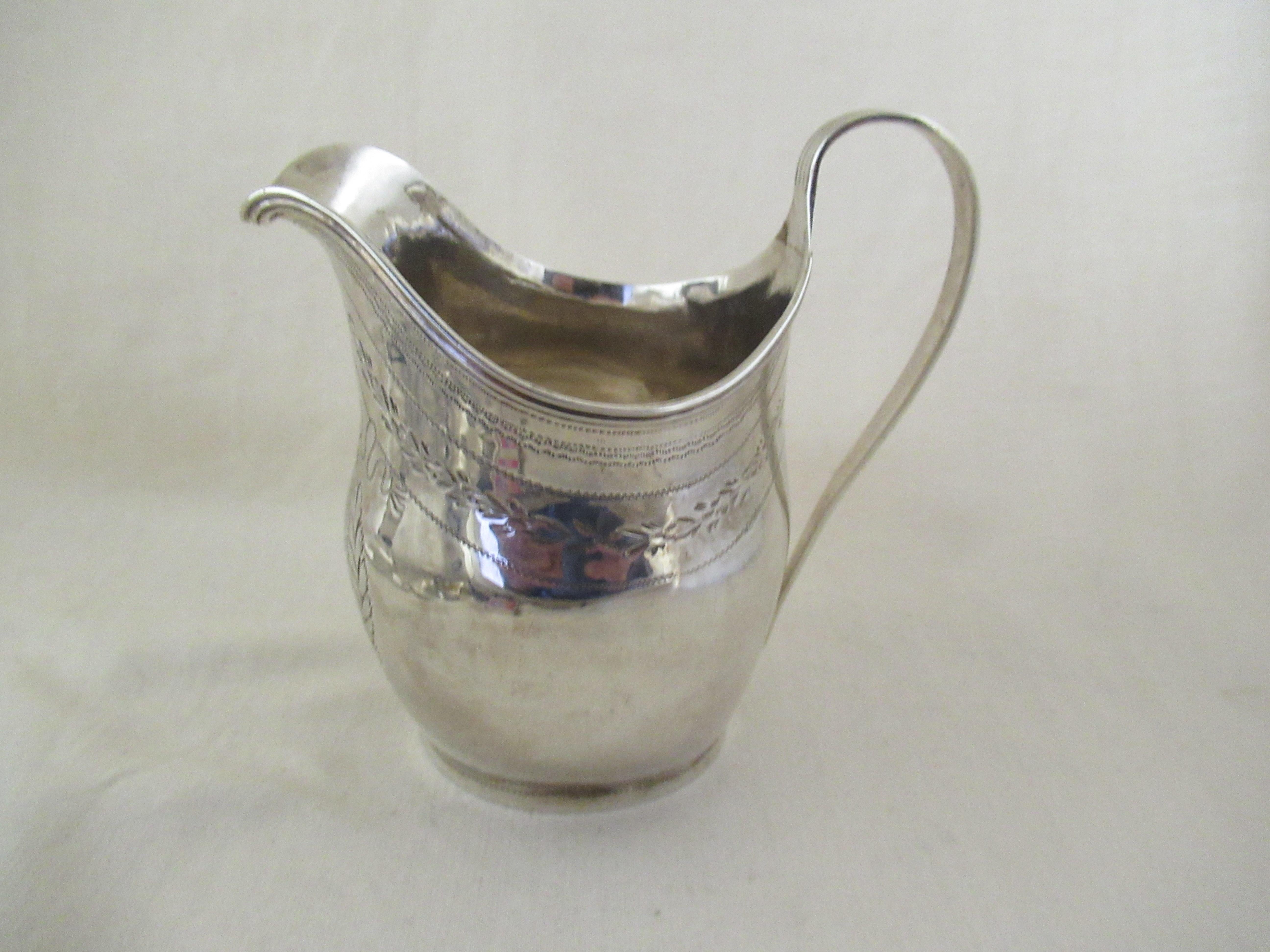 English Solid Sterling Silver  HELMET SHAPED CREAM JUG
Hallmarked for London 1800 with the maker`s mark - W V, for William Vincent.
----------------
A superb, helmet shaped cream jug.
Multi reeded 