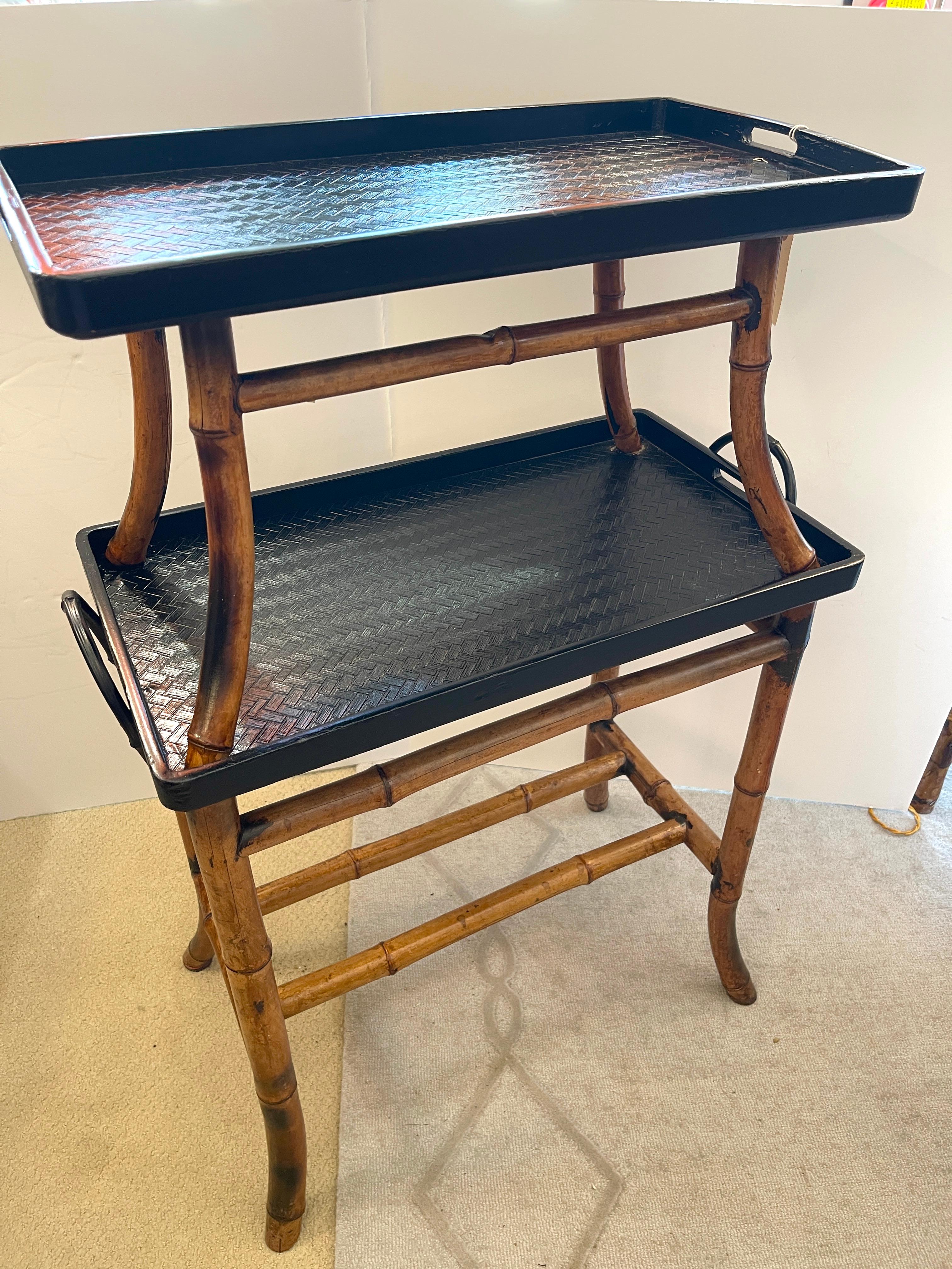 English Antique Two Tiered Burnt Bamboo Dessert Table/Serving Table
This a very useful and quite Charmin table.
The tray handles are Blametal faux bamboo
The grasscloth on the trays has been replaced, not original to the antique table.
Very good
