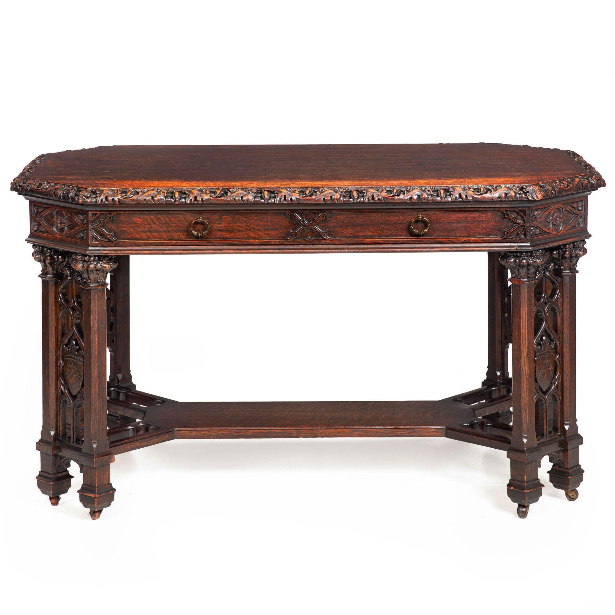 NEO-GOTHIC CARVED OAK-LEAF WRITING TABLE
England, ca. 1880
Item # 311PZH09A

A brilliant library writing table from the last quarter of the 19th century, this vividly carved and intelligently conceived design features primary surfaces of oak and oak